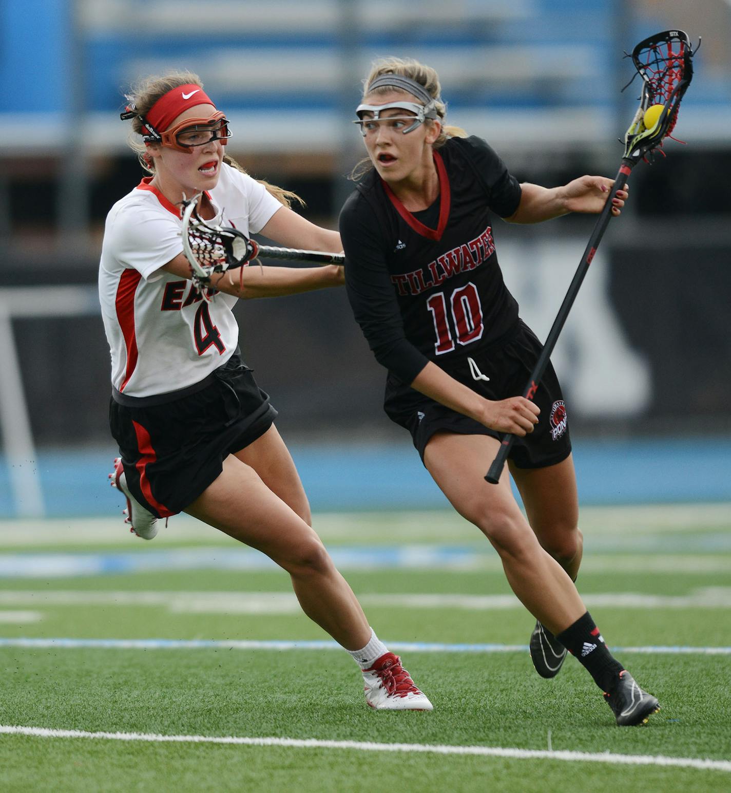 Eden Prairie's Jenny Bren screams at Stillwater Area's Kacie Riggs in the 1st half Thursday evening in Minnetonka. ] RACHEL WOOLF &#xef; rachel.woolf@startribune.com Eden Prairie met Stillwater Area in a girls state lacrosse tournament semifinal game at Minnetonka High School in Minnetonka Thursday evening, June 11, 2015.