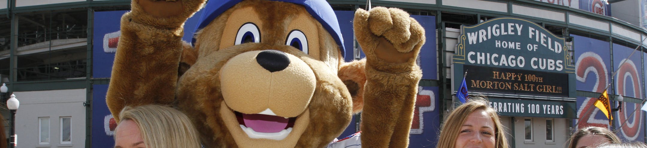 IMAGE DISTRIBUTED FOR MORTON SALT - Morton Salt Girls celebrate with Clark, the Cubs new mascot, in honor of the 100th birthday of the Morton Salt Girl and Wrigley Field on Saturday, May 17, 2014 in Chicago. The group gathered for Morton Salt Girl Day at Wrigley Field. (John Konstantaras/AP Images for Morton Salt) ORG XMIT: _K2_3501.JPG