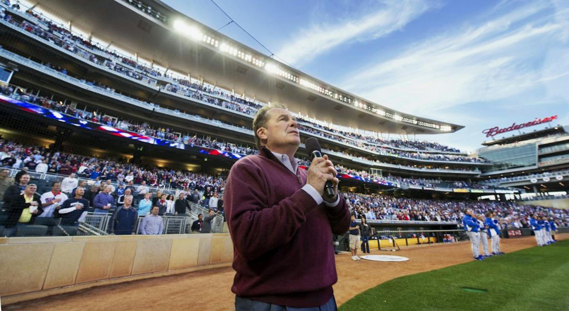 Frank Grecyzna sings the National Anthem before a Twins game.