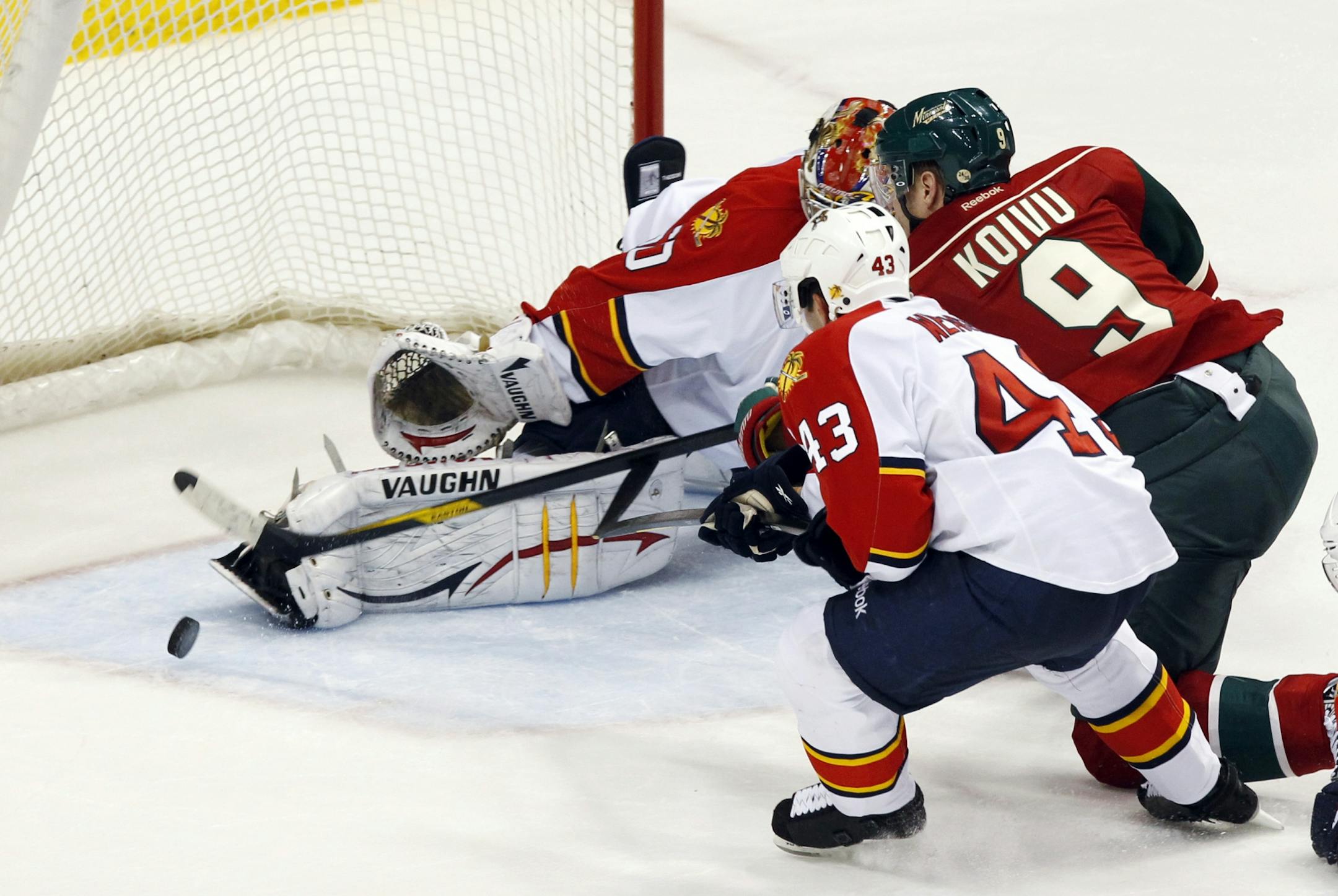 The Wild's Mikko Koivu (9) scored the game-winning goal in overtime against Florida goalie Jose Theodore.
