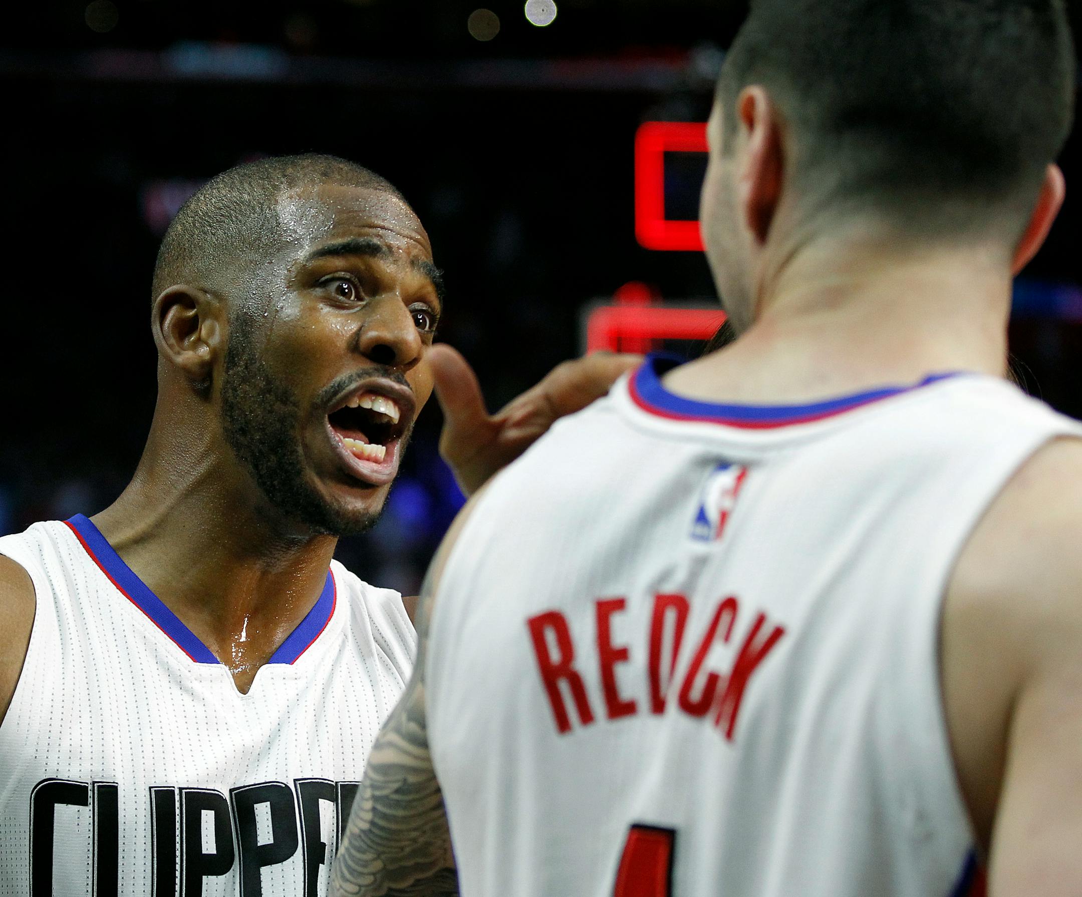 Clippers guard Chris Paul, left, celebrated with guard J.J. Redick after Redick's last-second shot defeated the Trail Blazers on March 24.