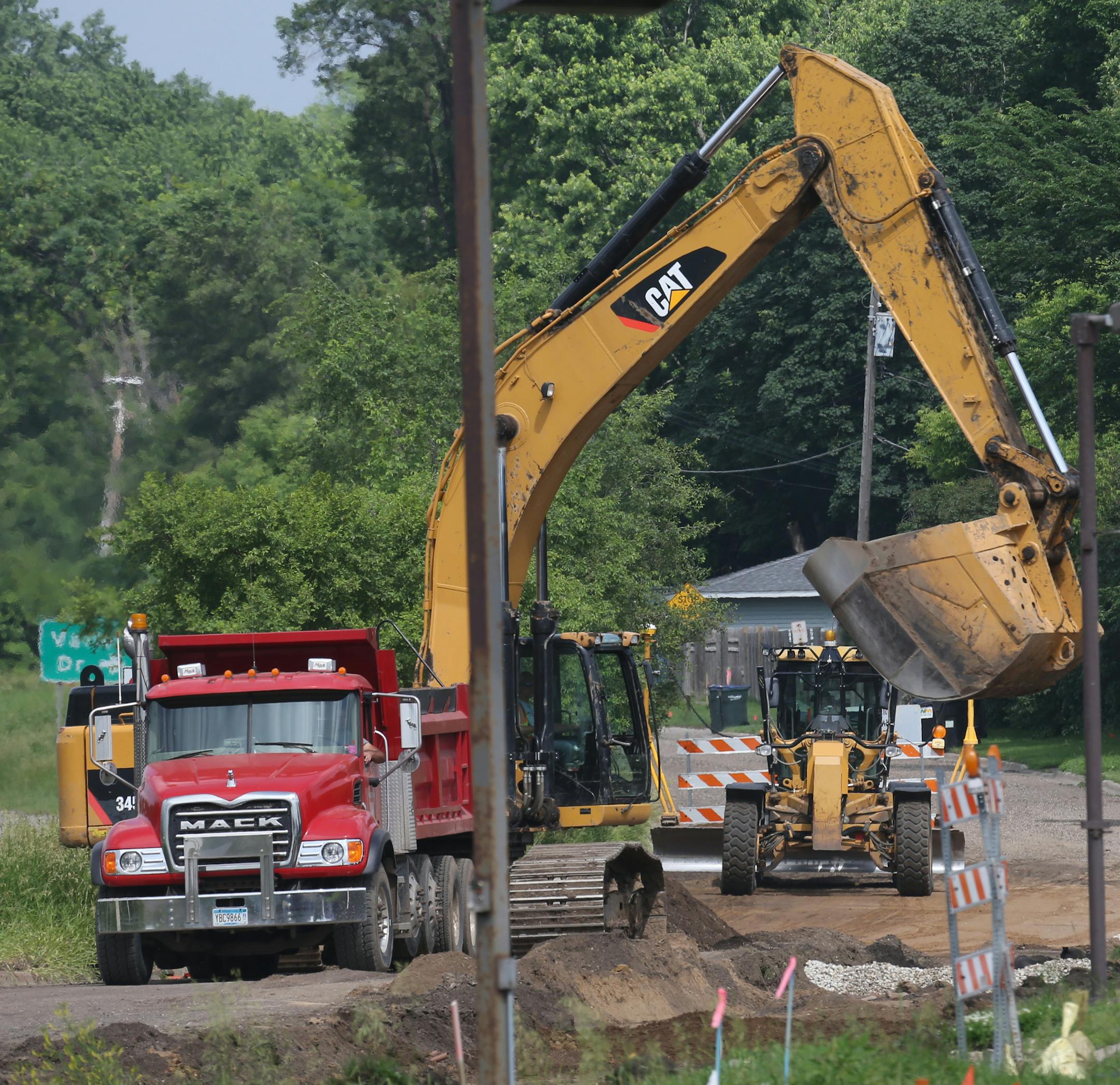 Traffic backed up at the intersection of County Road 5 and Highway 13 in Burnsville, were a new intersection if being built, as construction continued on the access roads, causing heavy traffic congestion on 6/25/13.] Bruce Bisping/Star Tribune bbisping@startribune.com