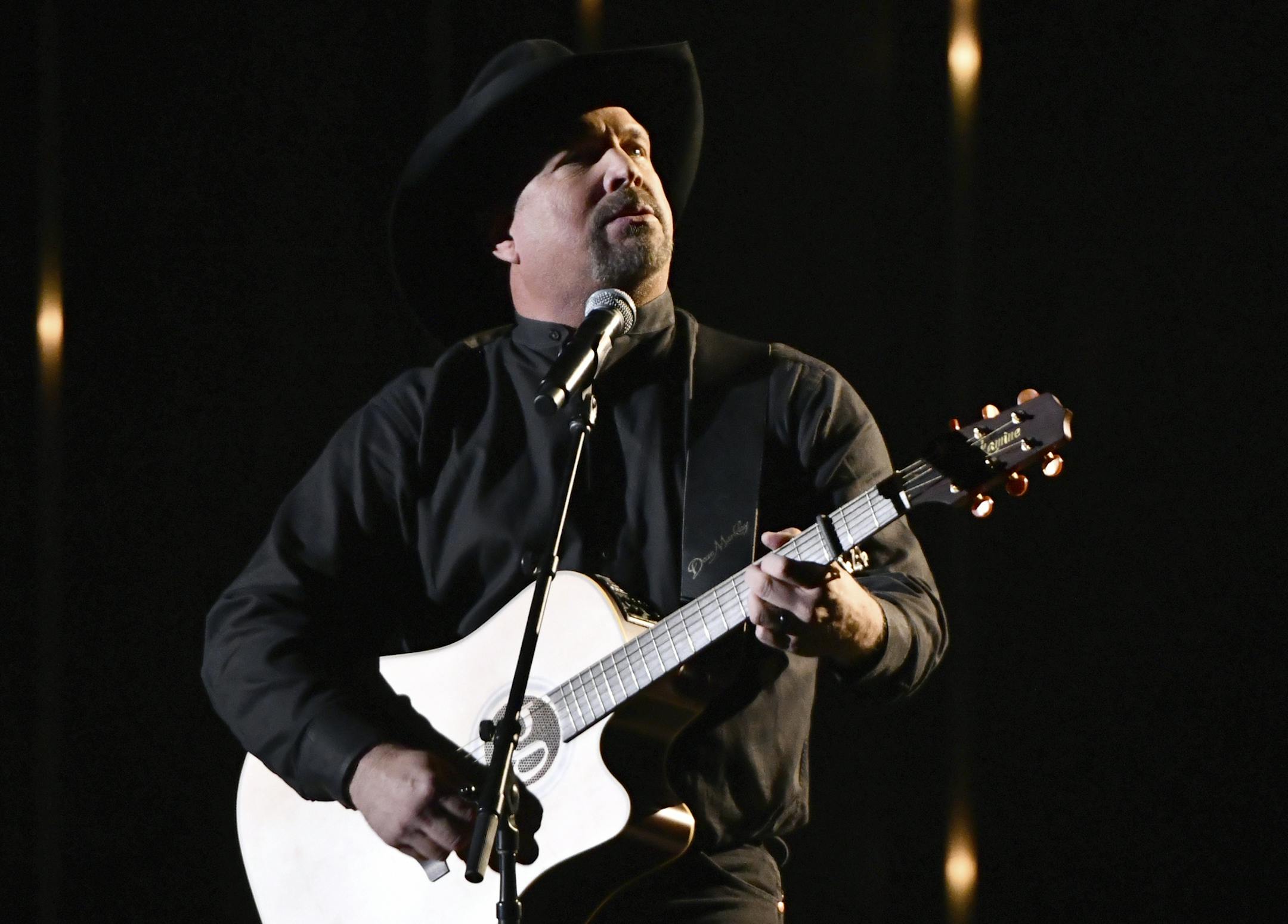 Garth Brooks performs "Stronger Than Me" at the 52nd annual CMA Awards at Bridgestone Arena on Wednesday, Nov. 14, 2018, in Nashville, Tenn. (Photo by Charles Sykes/Invision/AP)