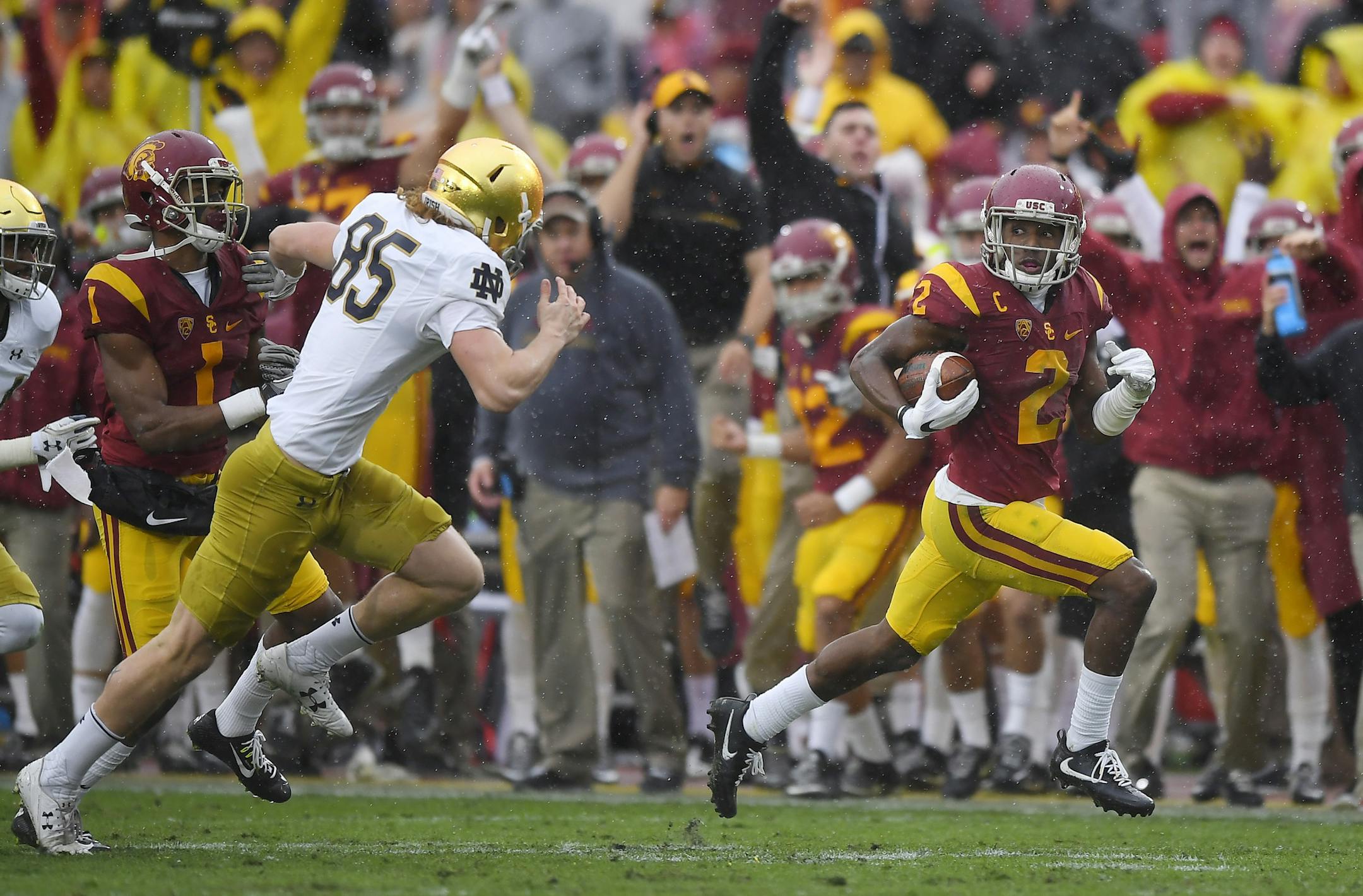 Southern California defensive back Adoree' Jackson, right, returns a punt 55 yards as Notre Dame punter Tyler Newsome defends for a touchdown for a touchdown during the first half of an NCAA college football game against Notre Dame, Saturday, Nov. 26, 2016, in Los Angeles. (AP Photo/Mark J. Terrill)