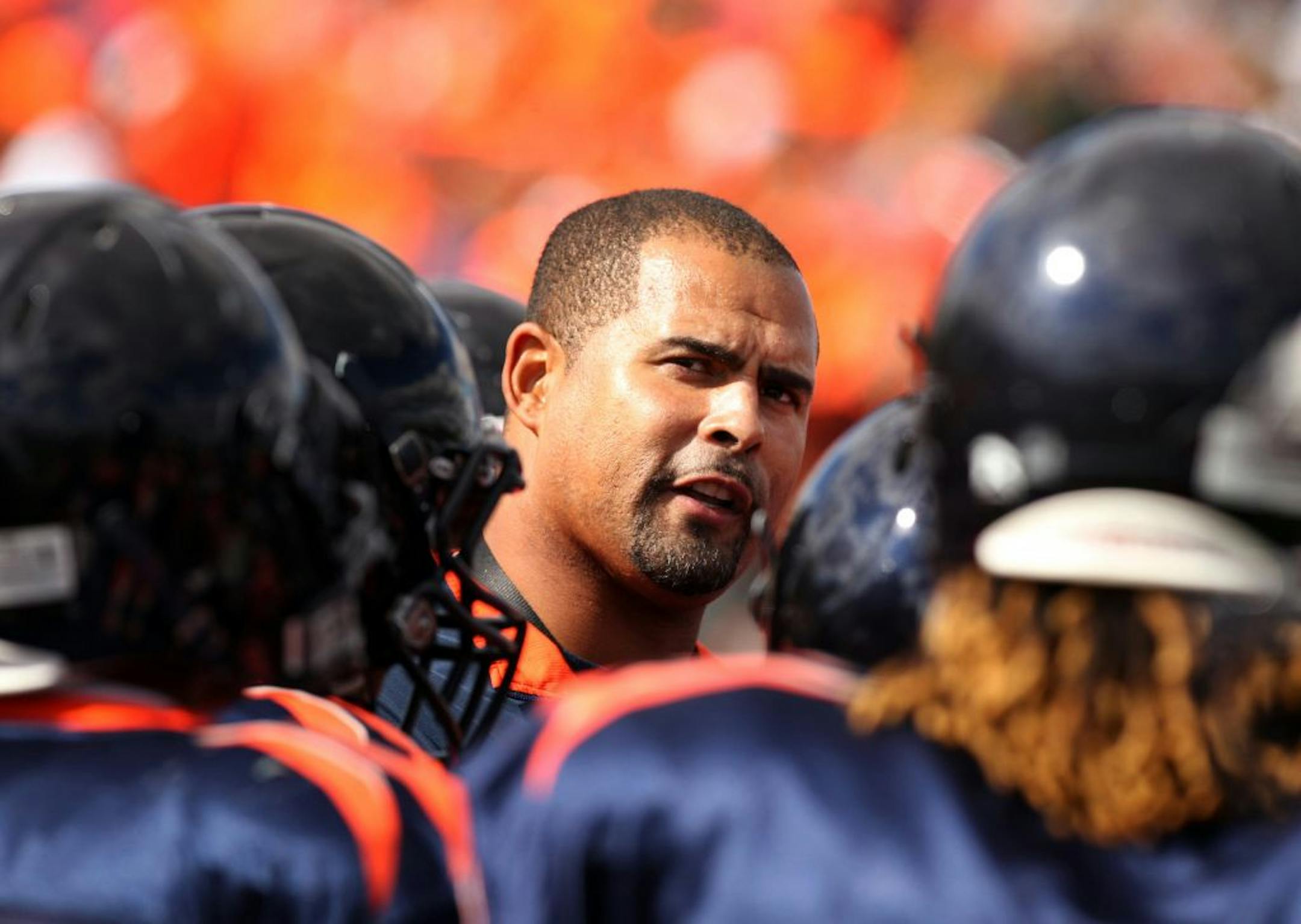Cooper High School football coach Willie Howard talks to his players before their game against Spring Lake Park on Sept. 22. in New Hope. Photo: Genevieve Ross/Special to the Star Tribune