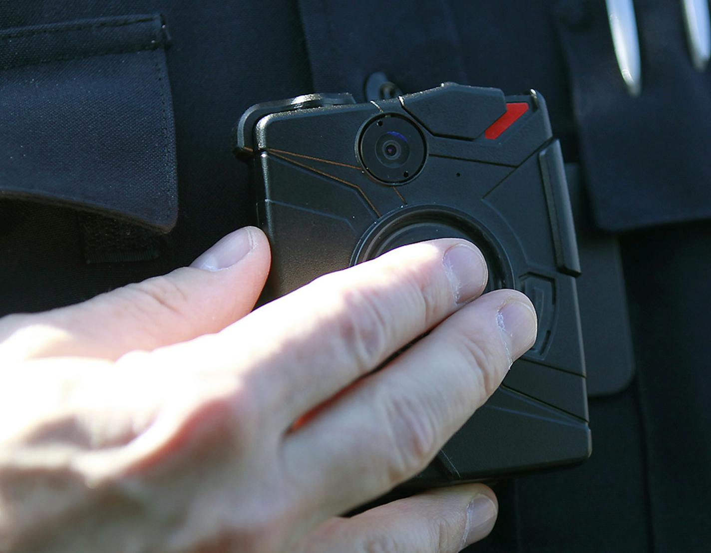 Columbia Heights police officer Terry Nightingale made sure to turn on his body cam before approaching a pedestrian for dangerously crossing the street, Friday, April 17, 2015 in Columbia Heights, MN. ] (ELIZABETH FLORES/STAR TRIBUNE) ELIZABETH FLORES &#x2022; eflores@startribune.com