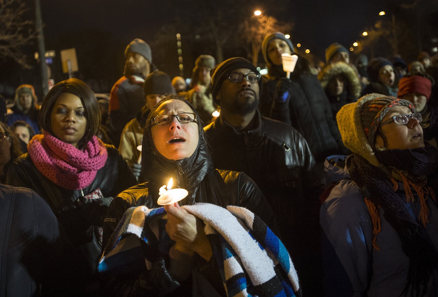 Hundreds of people of many races and backgrounds took part in Friday's rally and candlelight vigil that appeared to ease tensions.