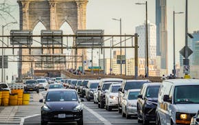 FILE - Traffic enters lower Manhattan after crossing the Brooklyn Bridge, Feb. 8, 2024, in New York. The Biden administration this week is expected to