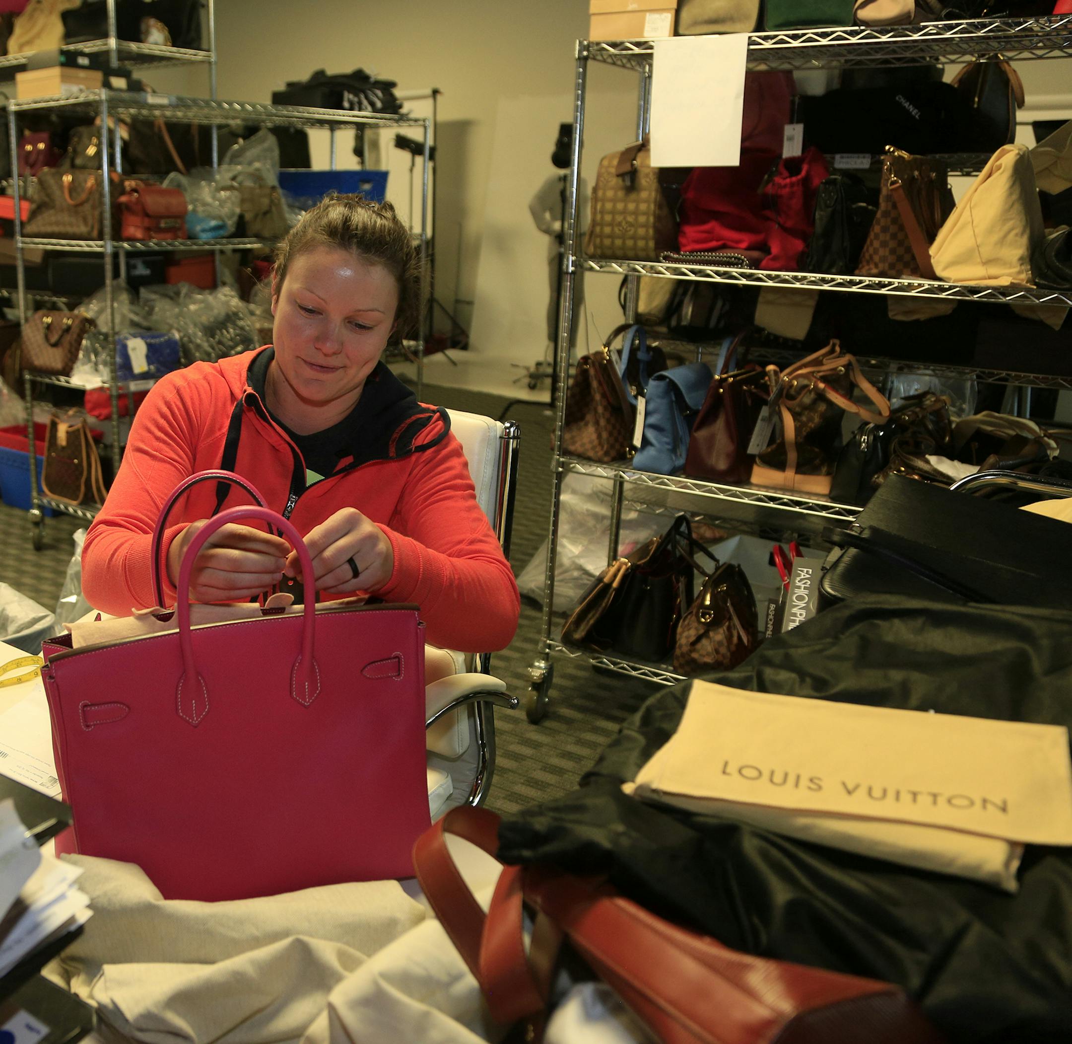 Fashionphile employee Danielle Whited registers a Hermes Epsom Candy Birkin bag that was sold to the Carlsbad, Calif., location. (David Brooks/San Diego Union-Tribune/TNS)