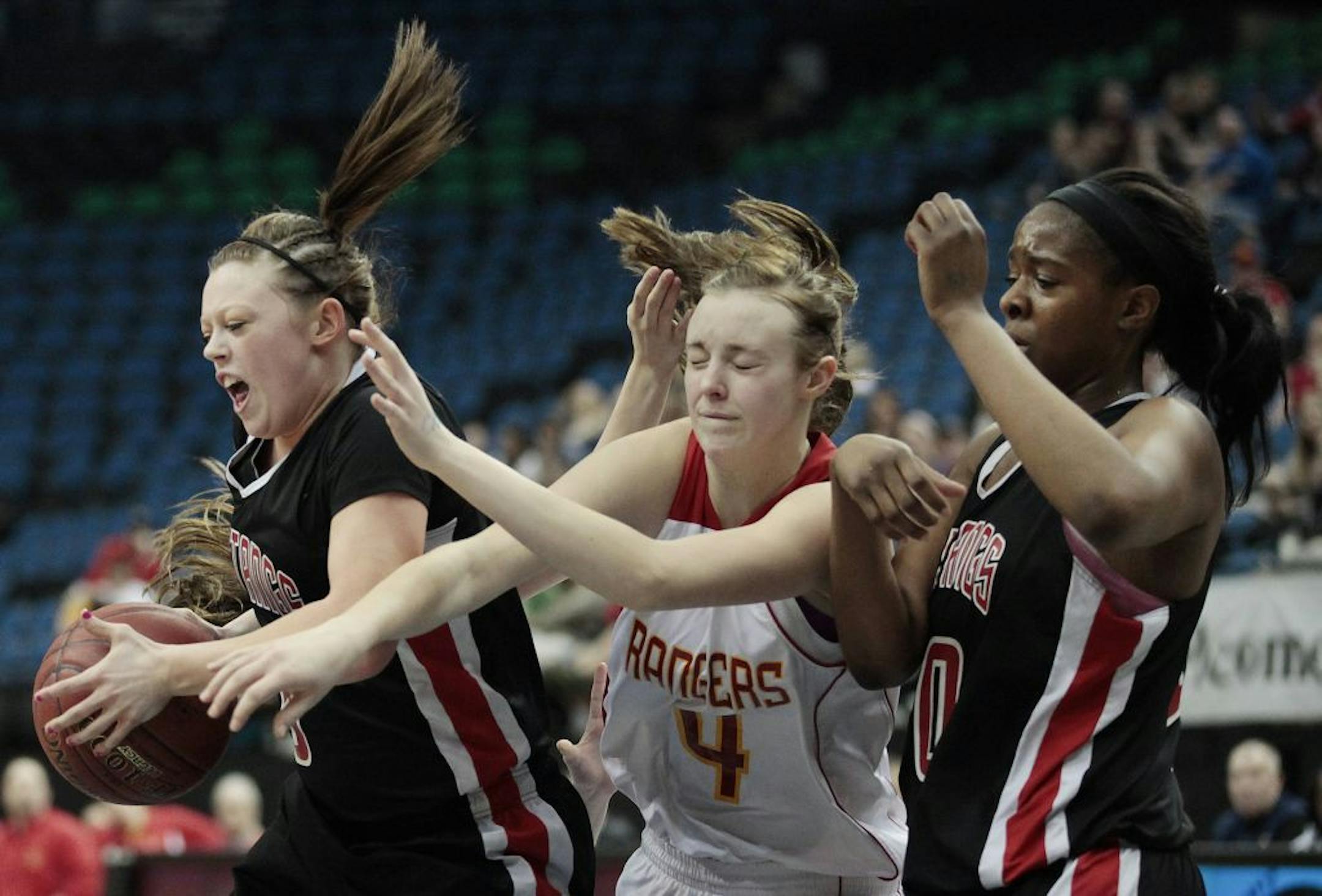 Maranatha Mustangs guard Abby Torgerson (3) breaks the ball away from Mountain Iron-Buhl Rangers forward Allie Knuti (4) in the first half of the Class A girls' state basketball championship game, Saturday, March 17, 2012, in Minneapolis.