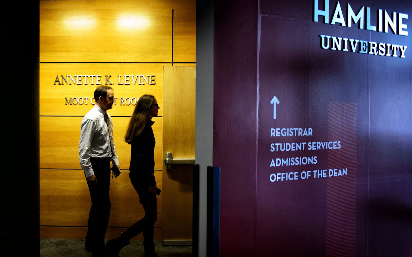 Hamline University Law School bar association president Alex Beeby closed the door after students entered the law school for the first of a series of information sessions held by the Dean to provide information about the merger with William Mitchell.