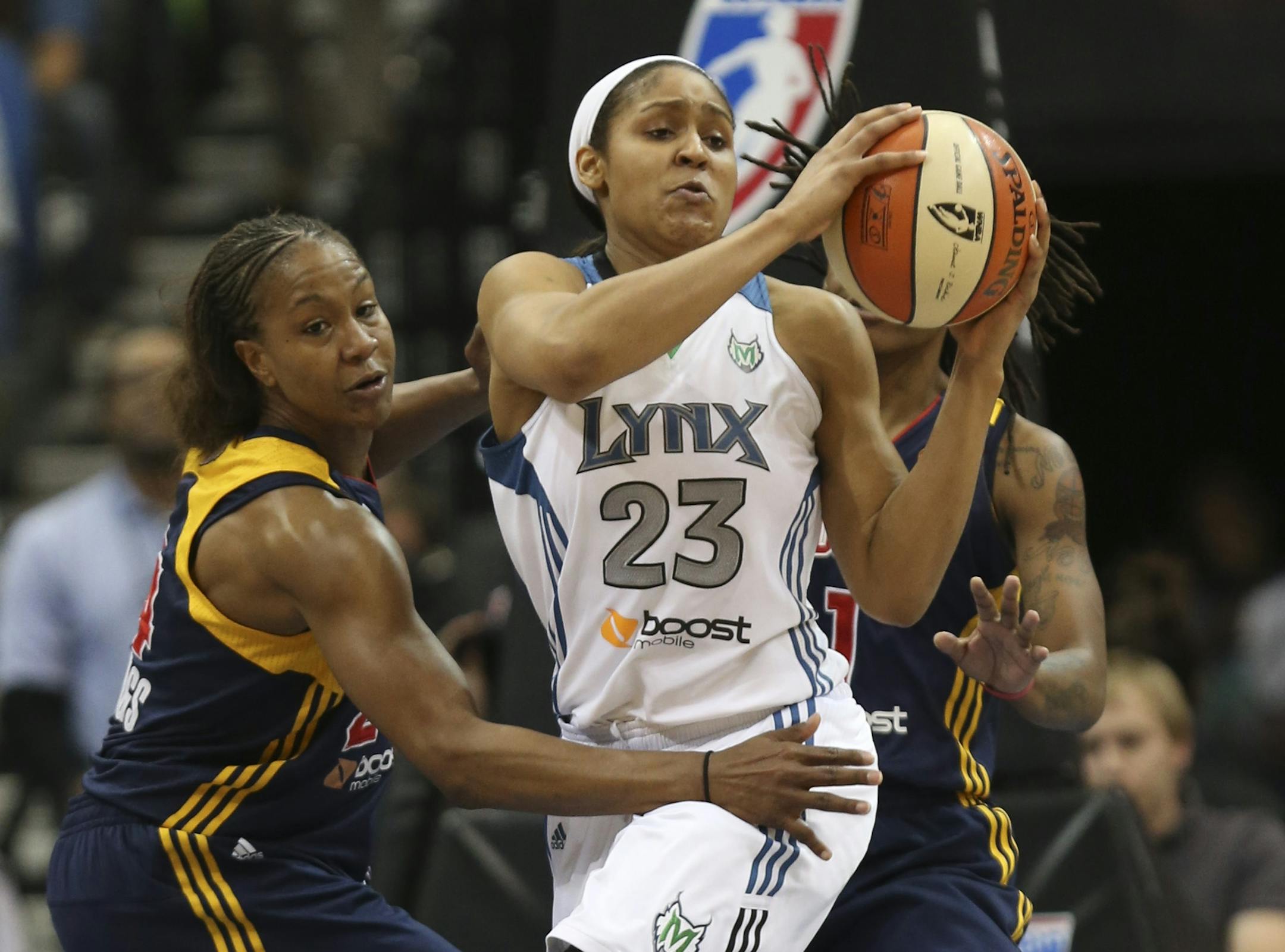 Lynx Maya Moore pulled a offensive rebound wih the Fever defending during the first half of game 1 of the WNBA finals in Minneapolis Min., Saturday October 13, 2012.