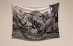 "Receiving Blanket," a plush blanket imprinted with a bombed-out building, is part of Essma Imady's exhibit "Thicker Than Water."