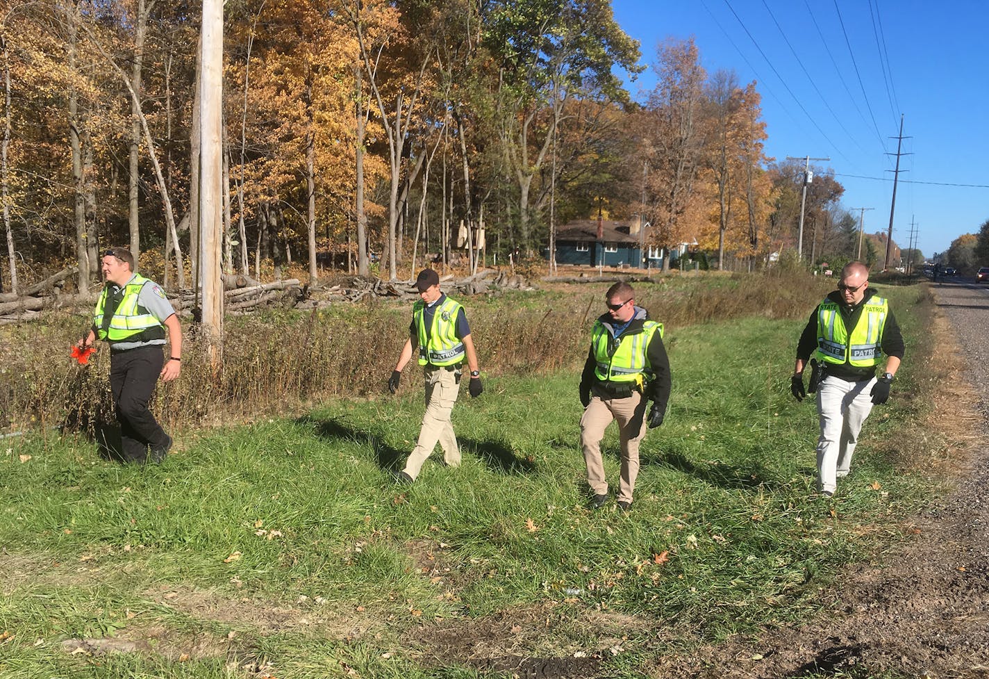 People search along Highway 8 near Barron, Wisconsin, for signs of Jayme Closs, the 13-year-old girl who has been missing since early Monday, after her parents were found dead in their home.