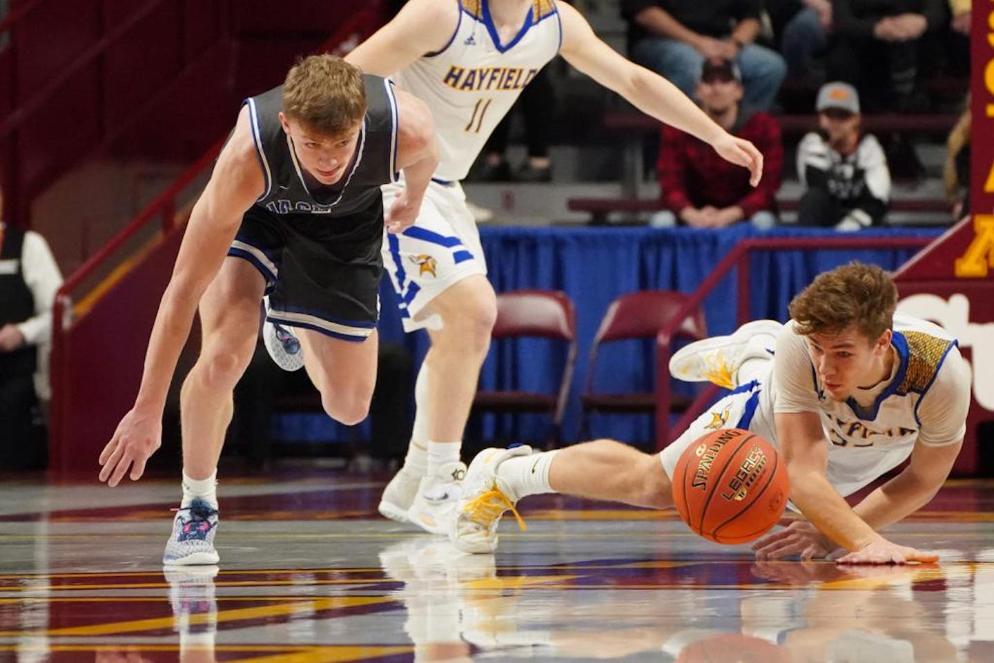 Hayfield Vikings forward Brody O'Malley, 33, and Belgrade-Brooten-Elrosa Jaguars guard Kaden Pieper, 1, both scramble for a loose ball in the first half Saturday, March 26, 2022 in Minneapolis, Minn. Hayfield played B-B-E in the boys' 1A state basketball championship. ] SHARI L. GROSS ??? shari.gross@startribune.com