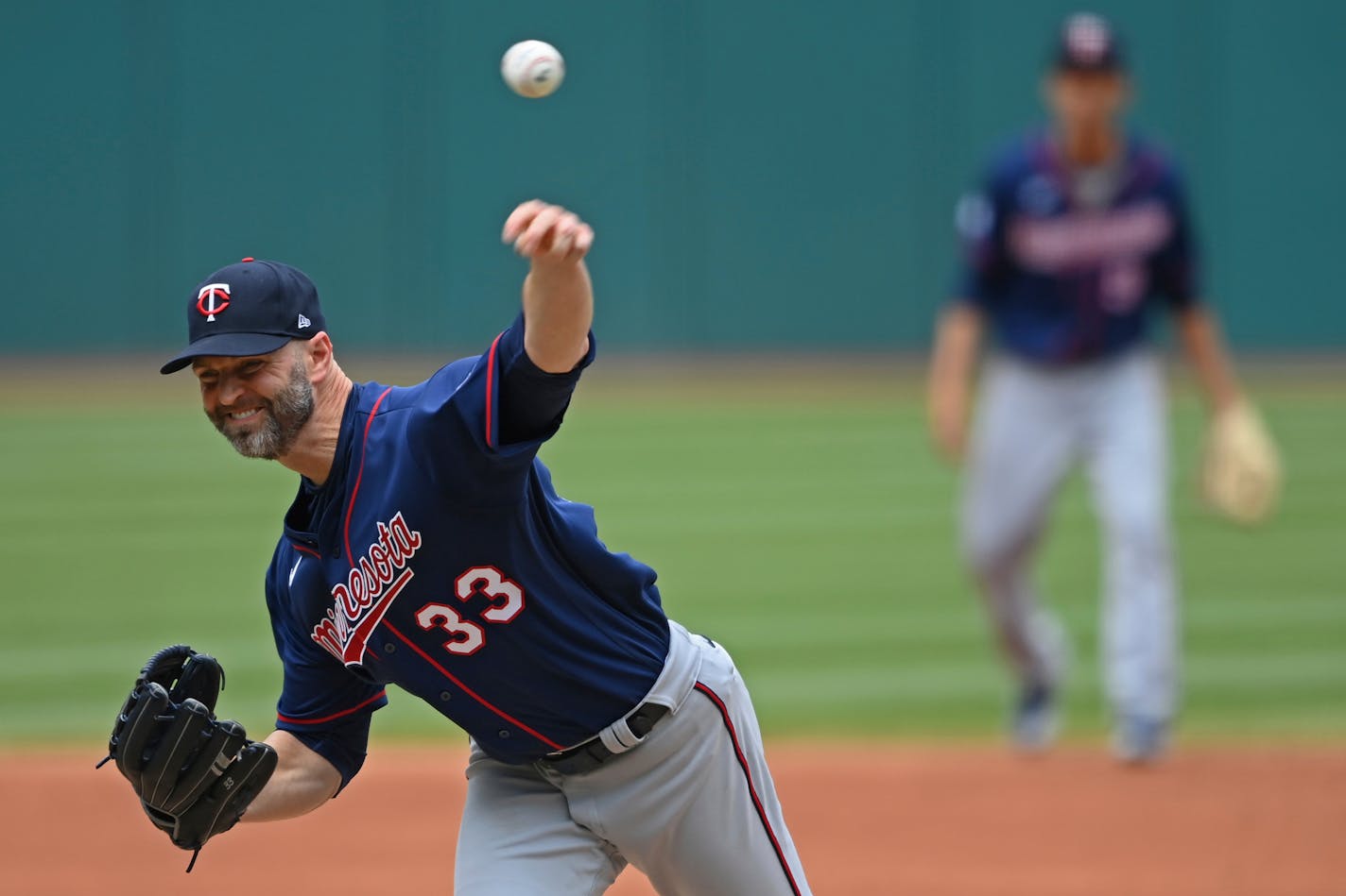 Minnesota Twins starting pitcher J.A. Happ (33) delivers in the first inning of a baseball game against the Cleveland Indians, Wednesday, April 28, 2021, in Cleveland. (AP Photo/David Dermer)