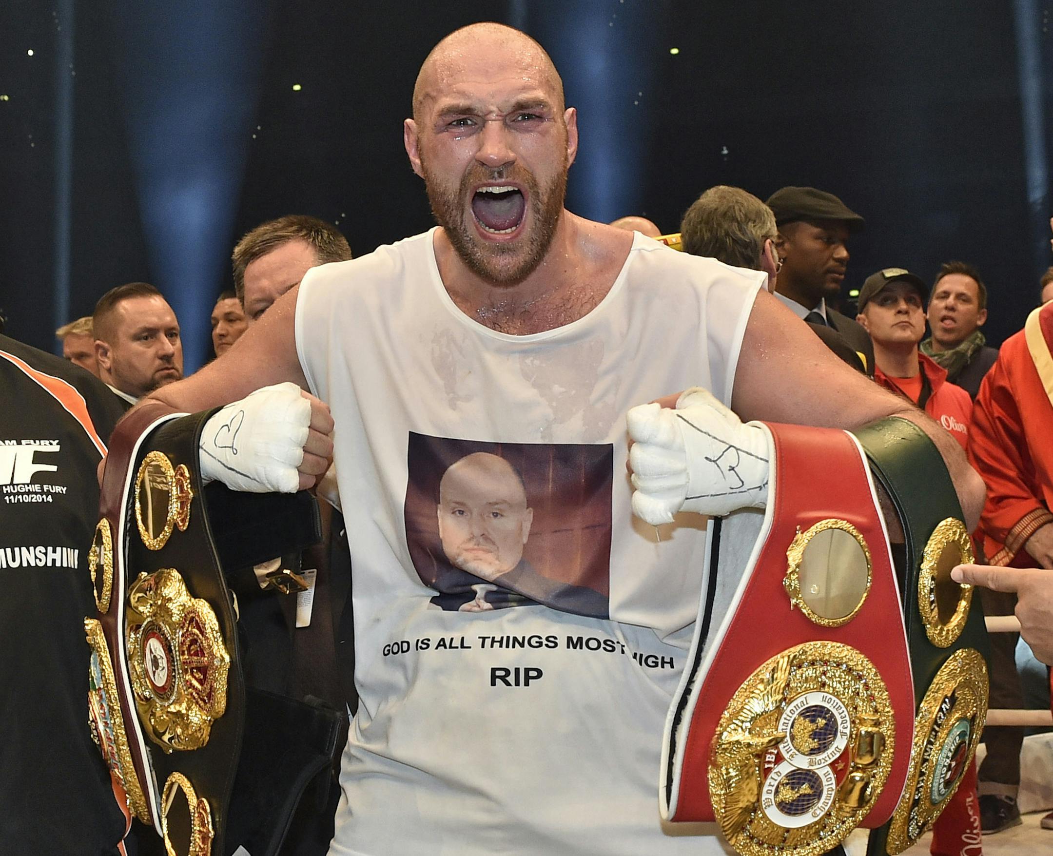 FILE - In this Nov. 29, 2015 file photo, Britain's new world champion Tyson Fury, celebrates with the WBA, IBF, WBO and IBO belts after winning the world heavyweight title fight against Ukraine's Wladimir Klitschko in Duesseldorf, western Germany. Tyson Fury's boxing career could be over after the reigning IBF, WBO and WBA heavyweight champion announced his retirement in a profanity-filled tweet on Monday Oct. 3, 2016. (AP Photo/Martin Meissner, File)