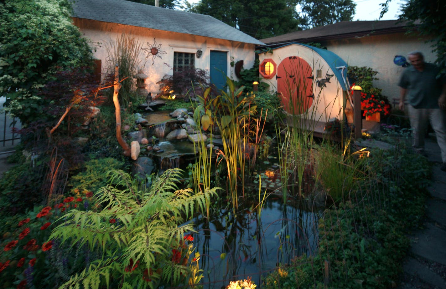 Beautiful Garden winner: Cordelia Anderson and Mike Humleker didn't let a small city lot stop them. They've created a whinmsical backyard getaway with waterfalls, ponds, bluestone patio, bridge and a hobbit house. Minneapolis, MN on August 5, 2013. ] JOELKOYAMA&#x201a;&#xc4;&#xa2;joel koyama@startribune