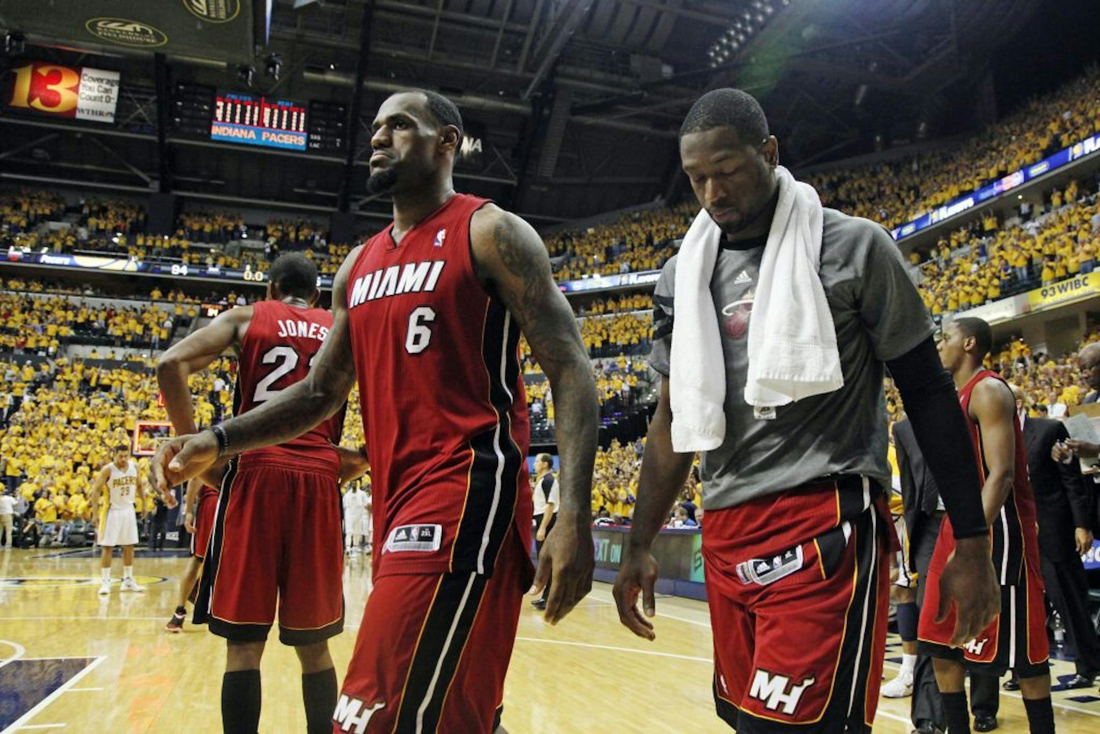 Miami Heat's LeBron James (6) and Dwyane Wade, right, leave the court after losing 94-75 to the Indiana Pacers in Game 3 of their NBA basketball Eastern Conference semifinal playoff series, Thursday, May 17, 2012, in Indianapolis.