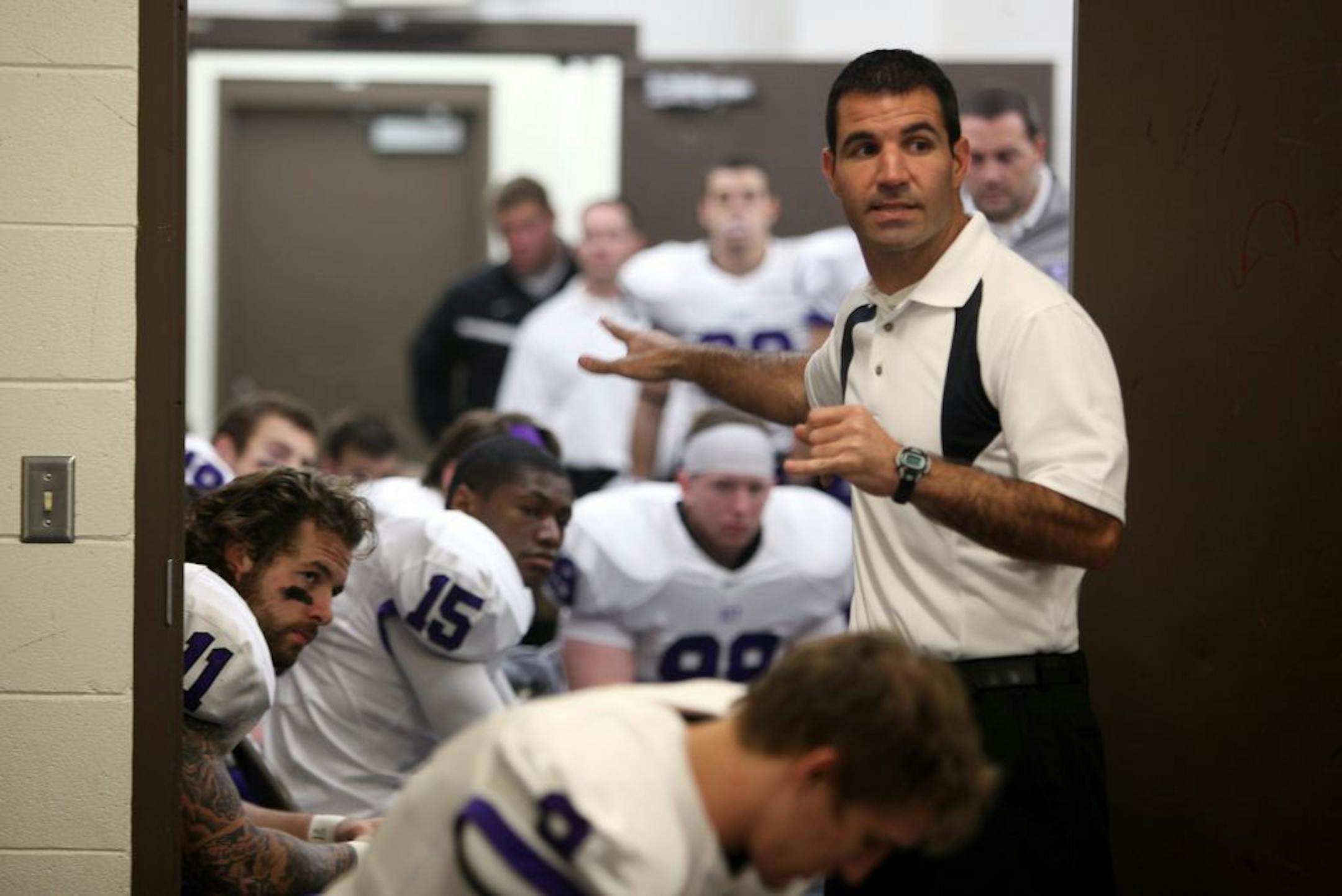St. Thomas head coach Glenn Caruso talked to his players before their game against Gustavus Adolphus.