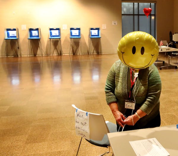 Election judge Carol Johnson tied a balloon to a chair before the polls opened Tuesday, Nov. 5, 2019, at the Arlington Hills Community Center in St. P