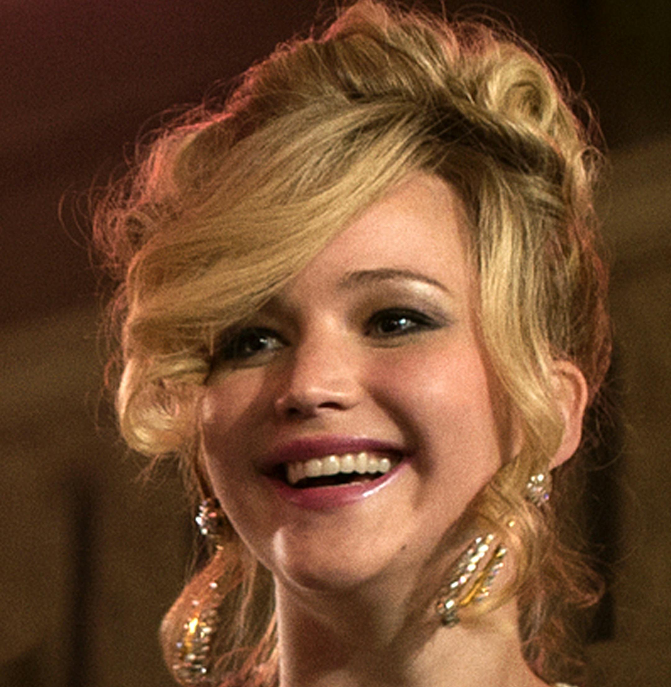 This film image released by Sony Pictures shows, from left, Amy Adams, Bradley Cooper, Jeremy Renner, Christian Bale and Jennifer Lawrence in a scene from "American Hustle." Lawrence was nominated for a Golden Globe for best supporting actress in a motion picture for her role in ìAmerican Hustle ì on Thursday, Dec. 12, 2013. The 71st annual Golden Globes will air on Sunday, Jan. 12. (AP Photo/Sony - Columbia Pictures, Francois Duhamel)