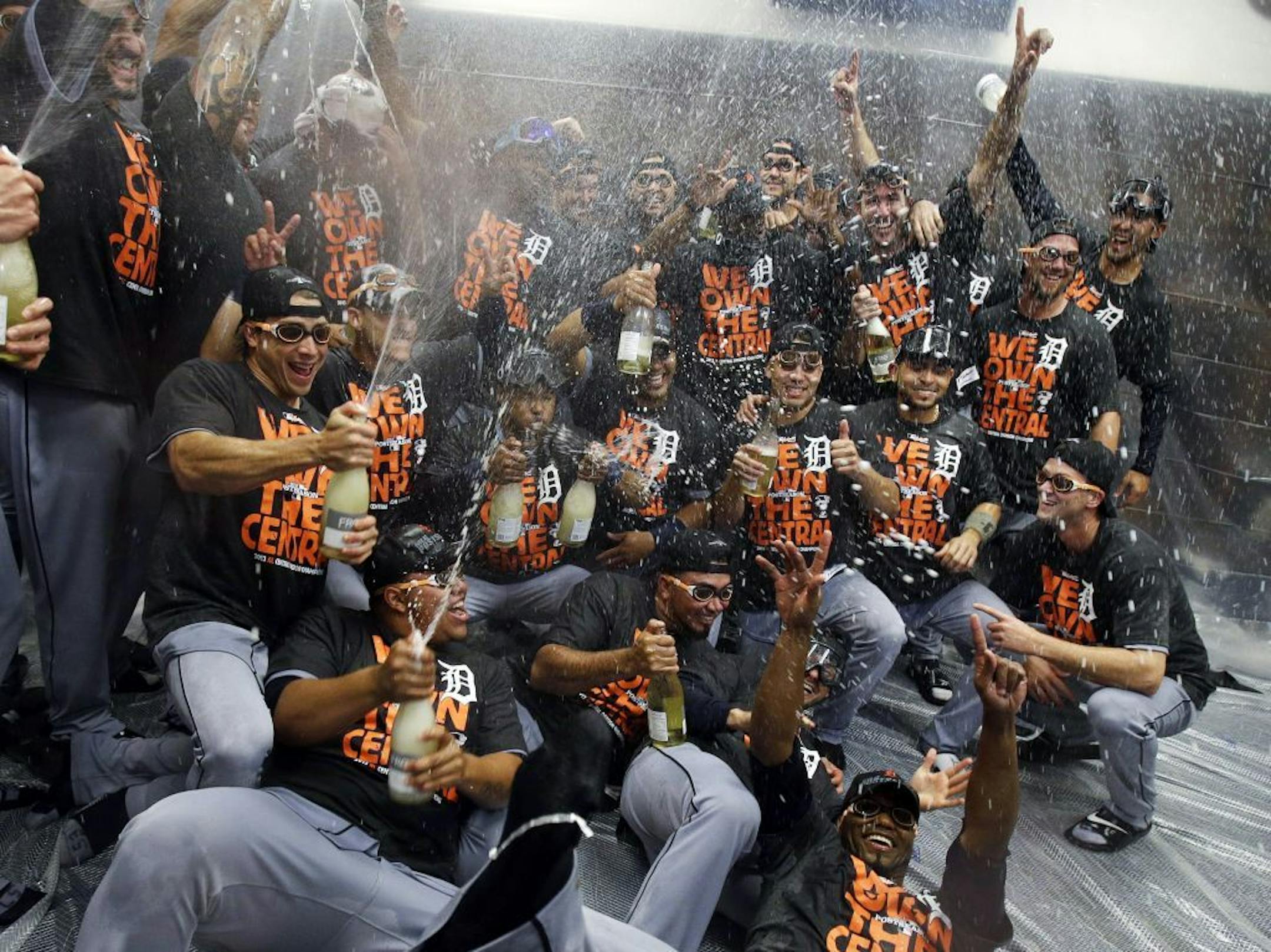 Detroit Tigers players celebrate after they defeated the Minnesota Twins 1-0 in a baseball game, Wednesday, Sept. 25, 2013, in Minneapolis. The Tigers clinched the AL Central title.