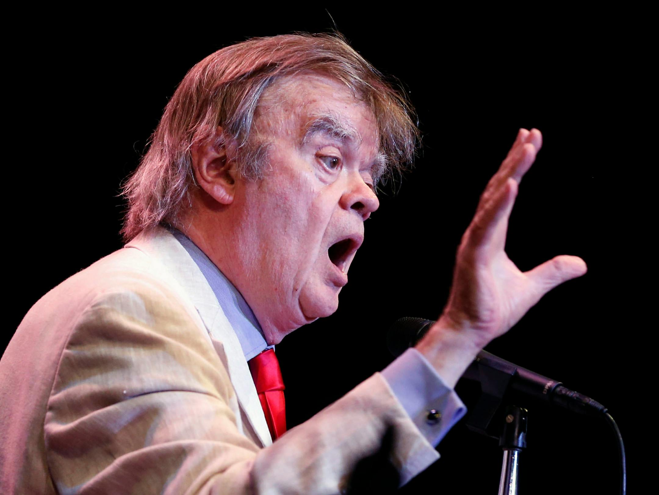 Garrison Keillor sings with the audience during an encore at the State Theatre in 2016.