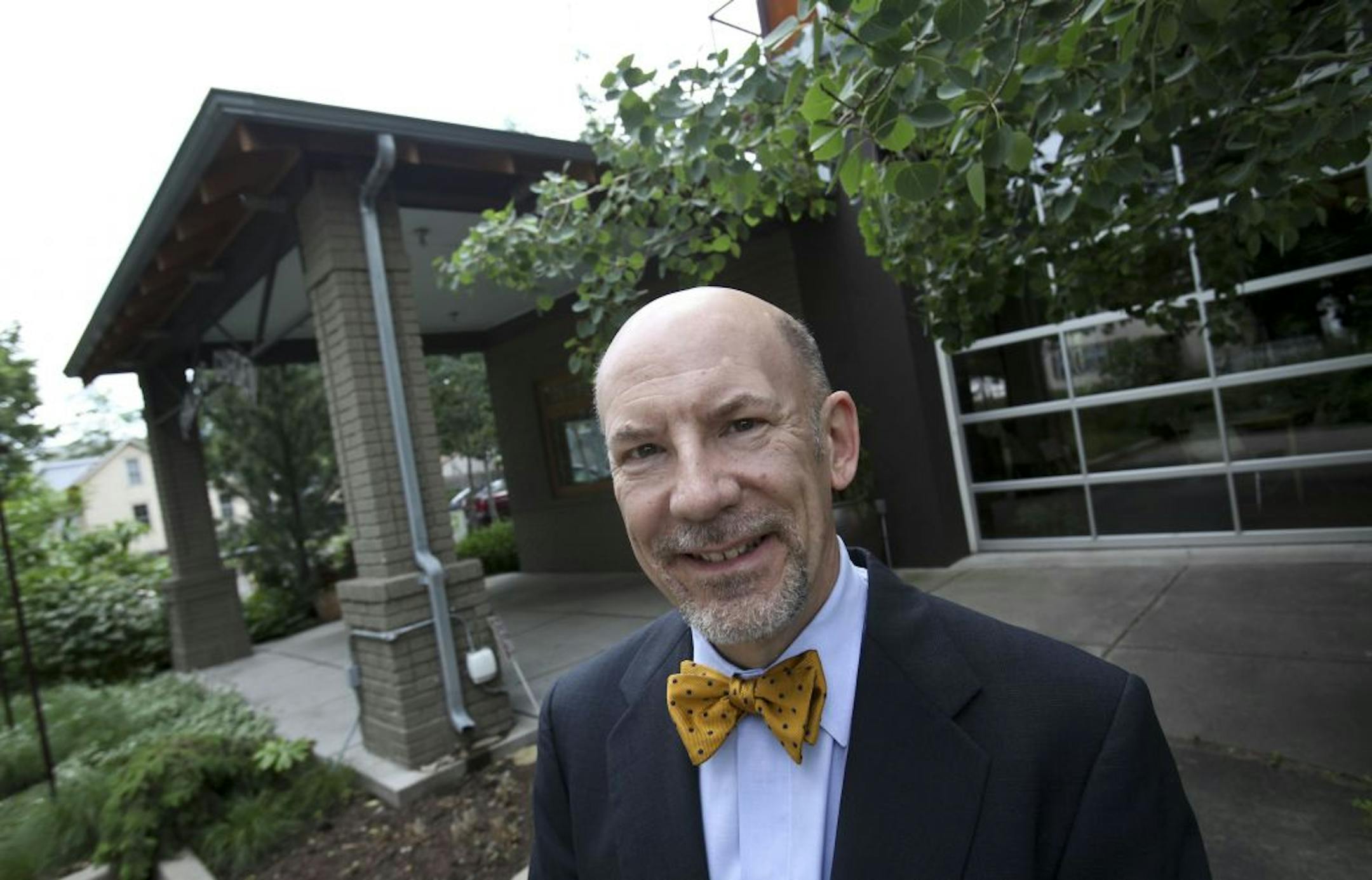 Frank Altman, CEO of Community Reinvestment Fund, stood in front of Phillips Garden, a landscape design business, that CRF helped finance.