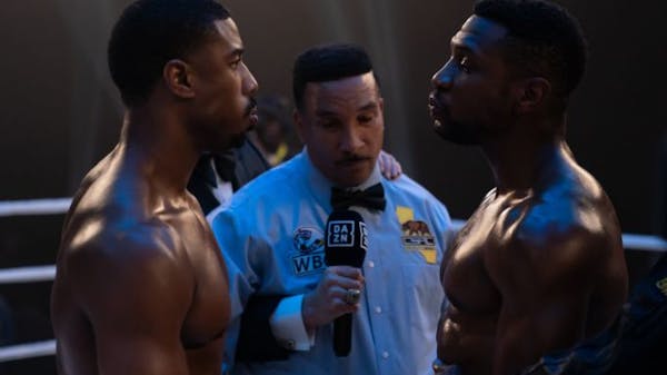 Adonis Creed (Michael B. Jordan, left) faces an old rival, played by Jonathan Majors, in “Creed III.”
