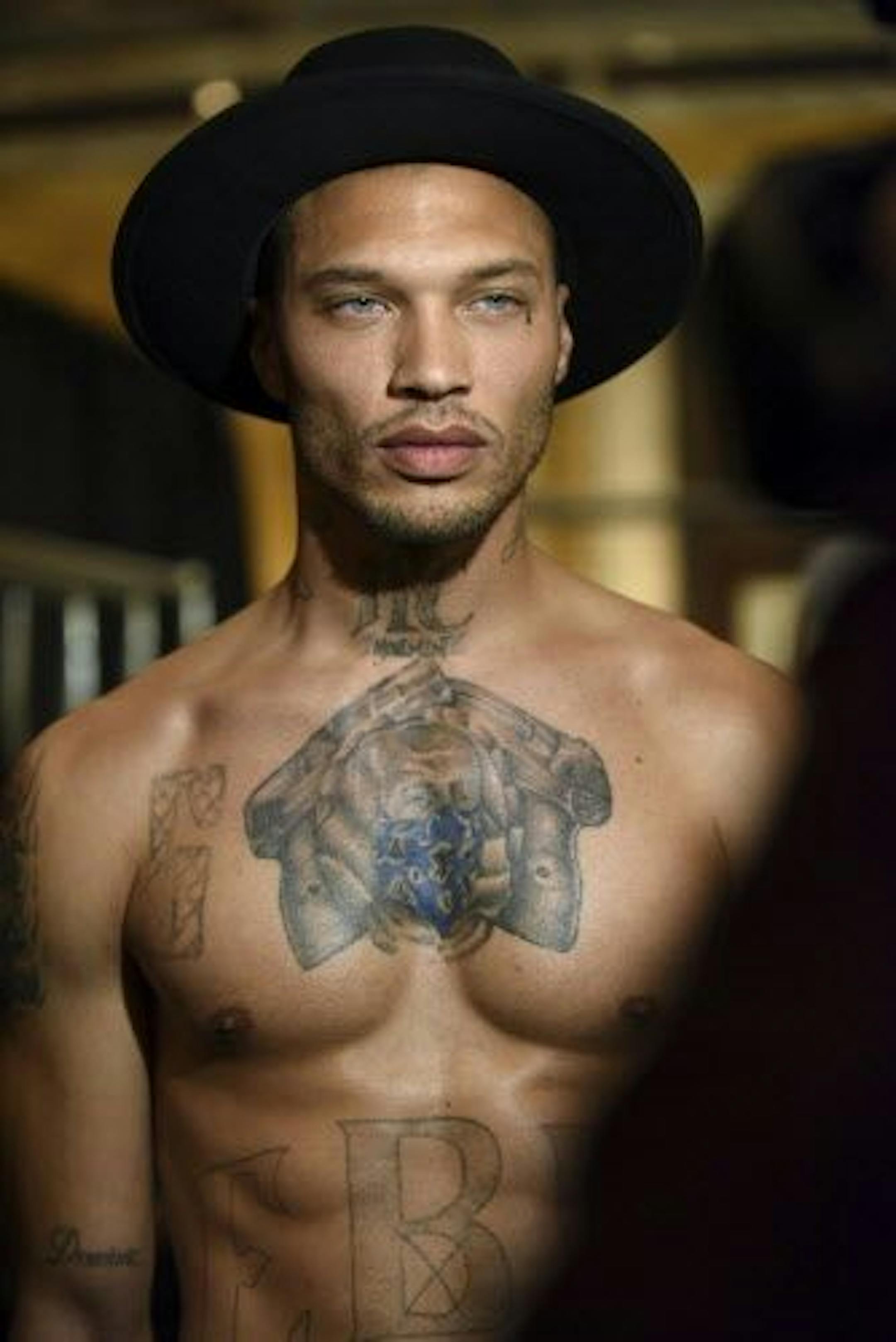 Jeremy Meeks, the model who was referred to as "the hot felon," poses backstage before the Philipp Plein fashion show, Monday, Feb. 13, 2017, in New York.