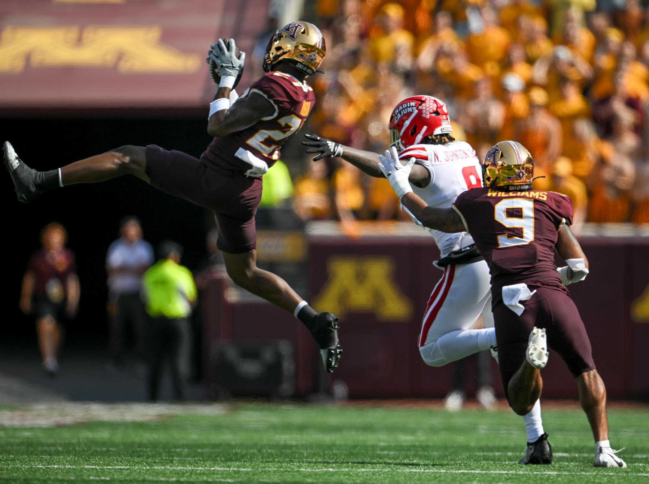 Minnesota Gophers defensive back Tyler Nubin (27) intercepts a pass intended for Louisiana-Lafayette Ragin Cajuns tight end Neal Johnson (9) in the fourth quarter Saturday, Sept. 30, 2023 at Huntington Bank Stadium in Minneapolis, Minn.