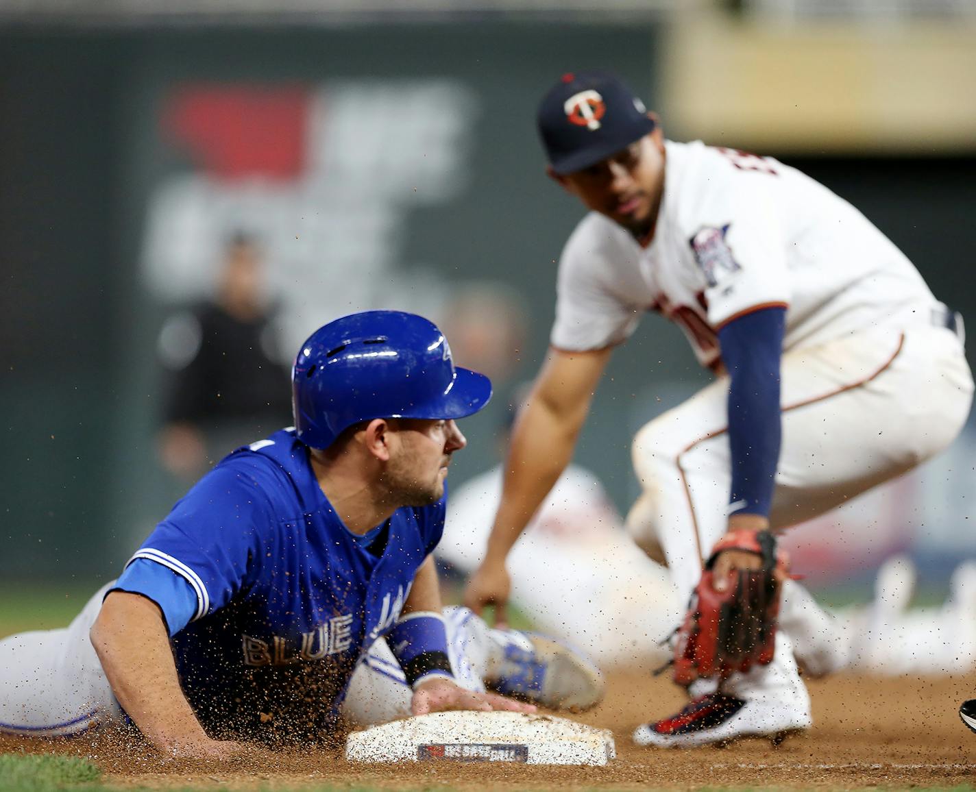 Blue Jays Luke Maile stole third base on Eduardo Escobar in the tenth inning at Target Field Tuesday May 1, 2018. ] The Minnesota Twins hosted the Toronto Blue Jays at Target Field. JERRY HOLT &#xef; jerry.holt@startribune.com