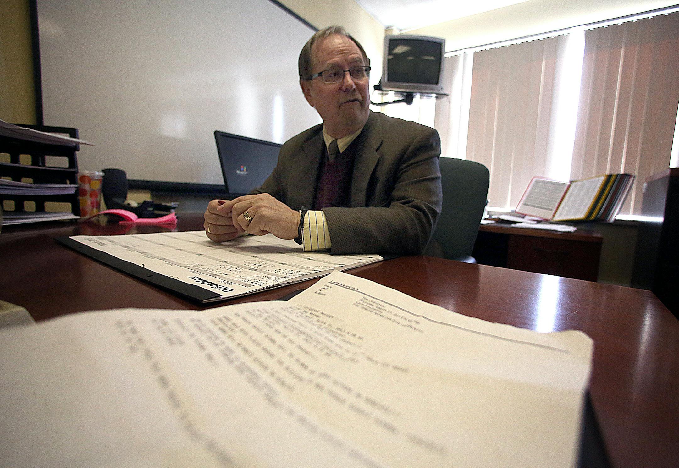 New Prague Schools Superintendent Larry Kauzlarcih discussed the recent bomb threat against the middle school that was received via e-mail (printed out in foreground).