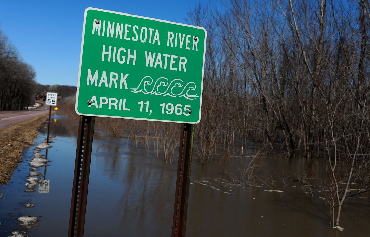 A sign along the flooded Minnesota River on March 20, 2019, near Belle Plaine, Minn. As much of the state braces for the potential flooding of yet another spring, state officials are seeking new ways to stop or reduce erosion along the Minnesota River.