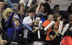 Basketball fans, many in costume, stood and cheered in the section allocated for Super Fans during the Minnesota Timberwolves game against the Houston