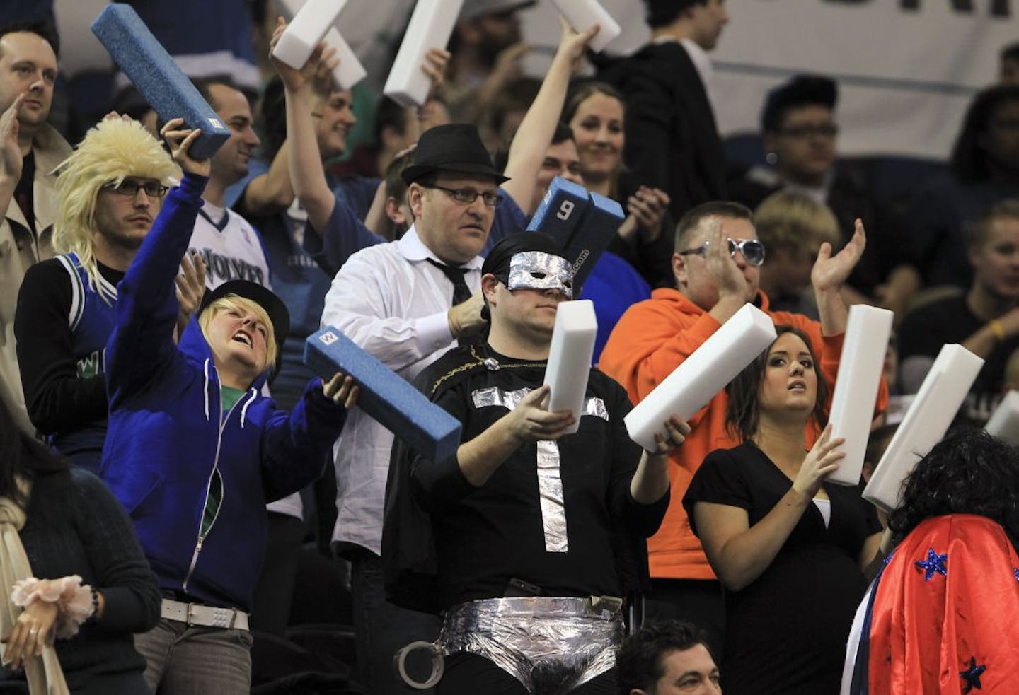 Basketball fans, many in costume, stood and cheered in the section allocated for Super Fans during the Minnesota Timberwolves game against the Houston Rockets Monday night, January 23, 2012, at Target Center in Minneapolis, Minn.