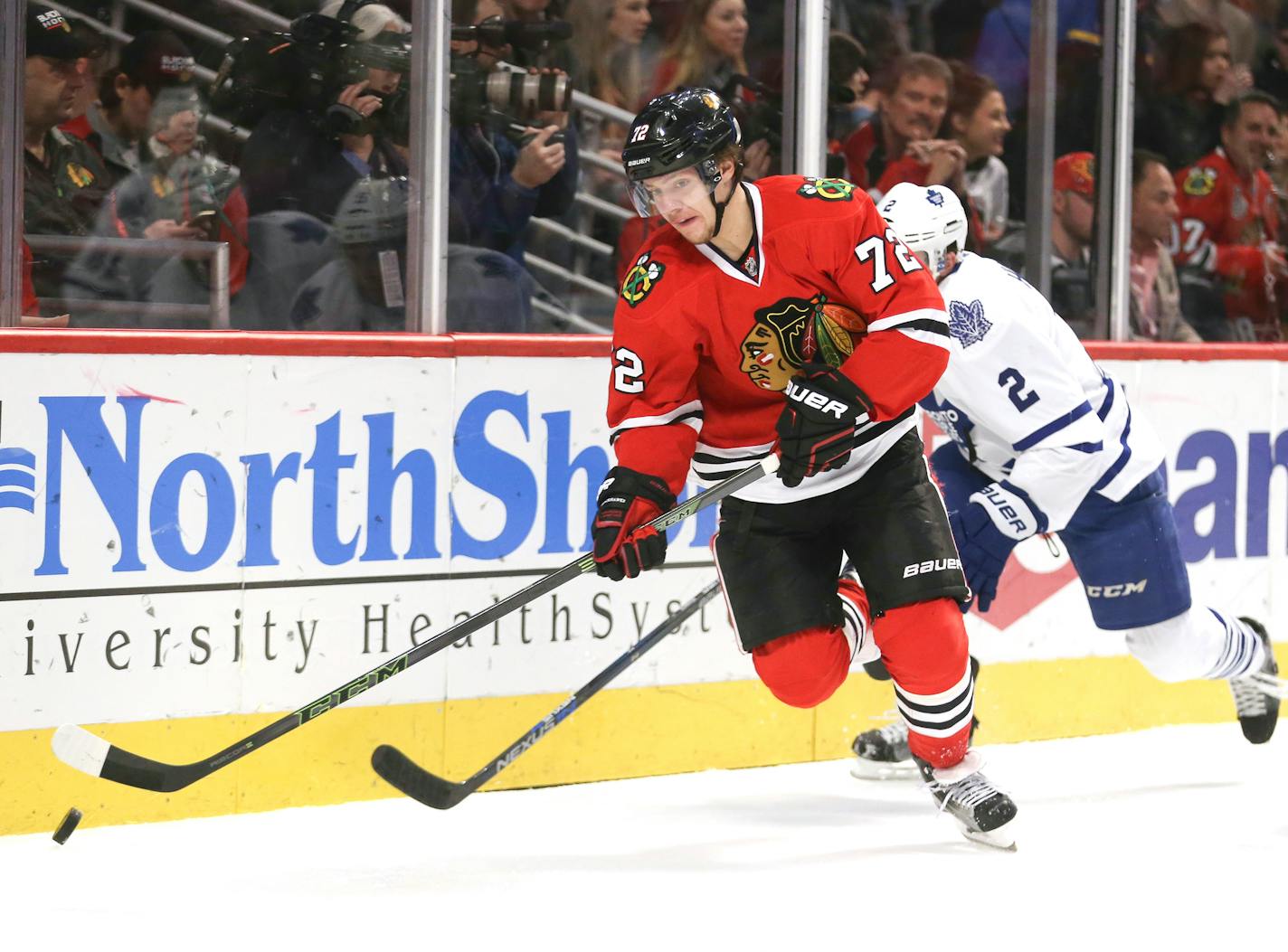 Chicago Blackhawks left wing Artemi Panarin (72) controls the puck in front of Toronto Maple Leafs defenseman Matt Hunwick (2) during the first period on Monday, Feb. 15, 2016, at the United Center in Chicago. (Nuccio DiNuzzo/Chicago Tribune/TNS)