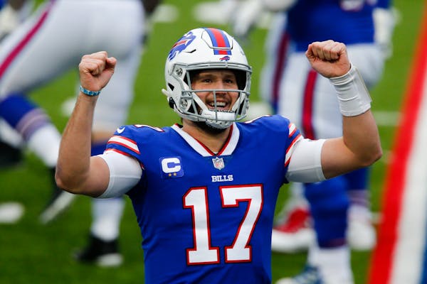 Buffalo Bills quarterback Josh Allen (17) reacts after throwing a touchdown pass in the first half of an NFL football game against the Miami Dolphins,