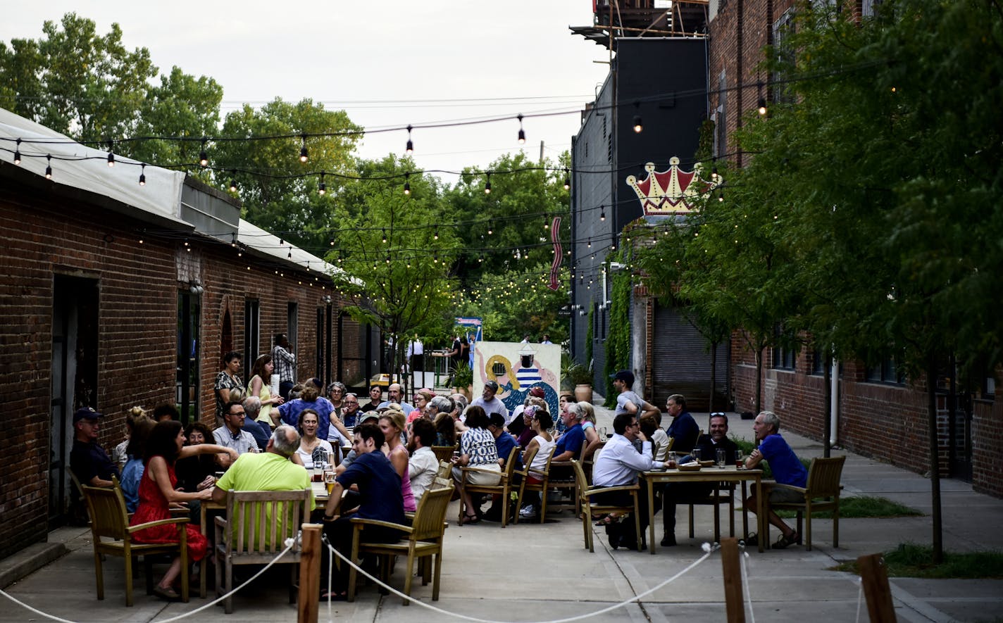 The scene outside Lake Monster Brewing Thursday night. ] AARON LAVINSKY &#x2022; aaron.lavinsky@startribune.com Over the past couple years, a corner of St. Paul running along the Green Line from Prior Avenue west to Hwy. 280 has been quietly booming. St. Paul's Creative Enterprise Zone, featuring an eclectic mix of potters and playwrights, builders and brewpubs, is home to businesses employing more than 43,000 people and has a heftier tax base than downtown St. Paul. Now those who helped create