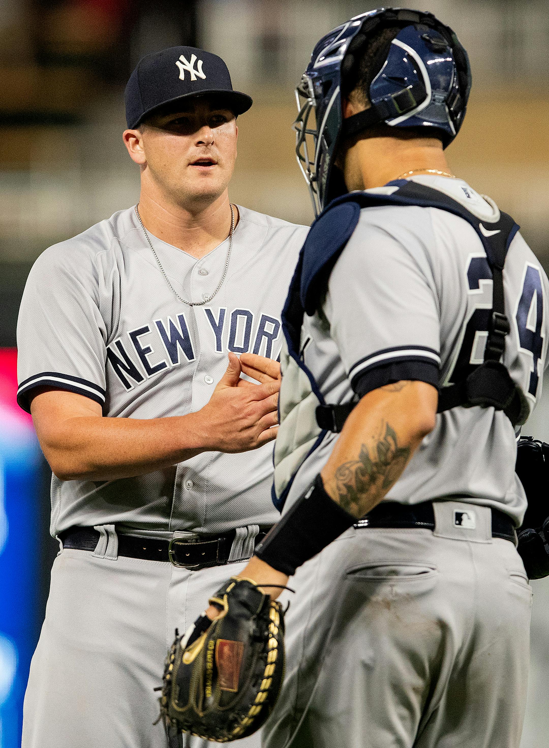Yankees pitcher Jonathan Holder (56) was congratulated by catcher Gary Sanchez at the end of the game.