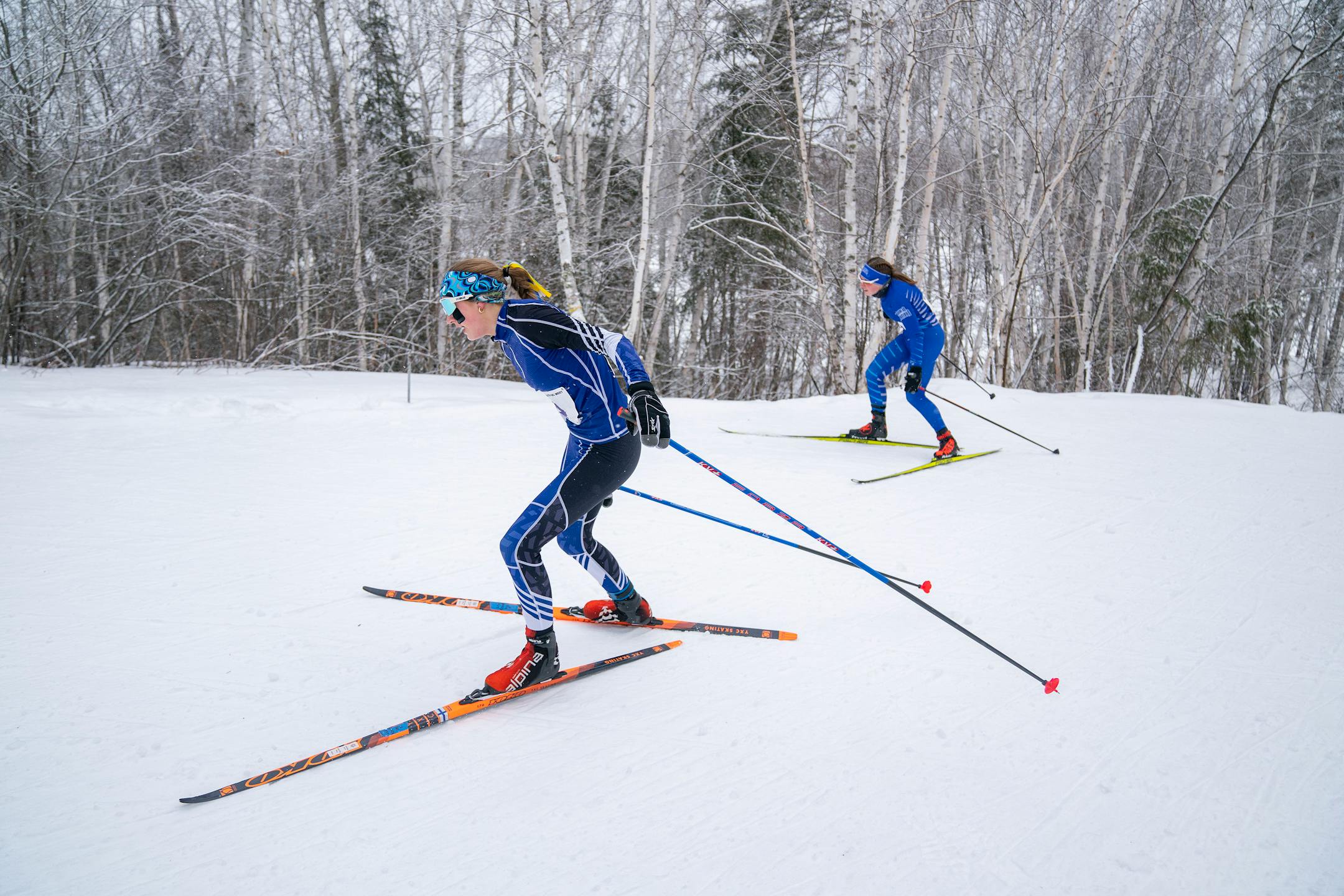 Eastview/Rosemount nordic skier Liza Kerndt (4) pulls ahead of Brainerd nordic skier Cally Robertson (3) in the girl's team sprint qualification race during the MSHSL Boys and Girls Nordic Ski Racing Meet.