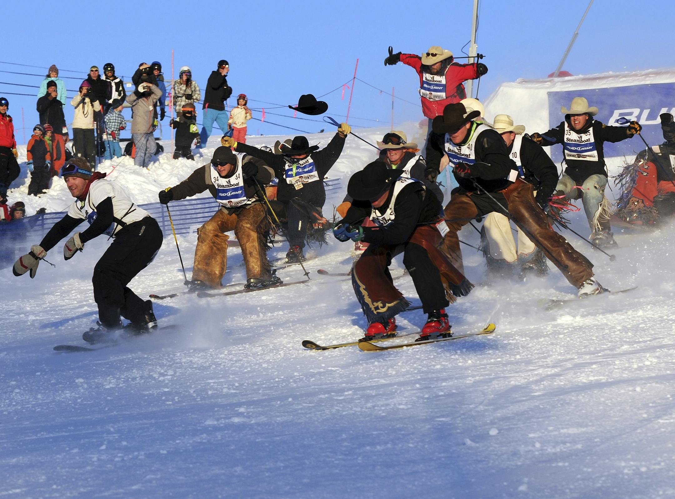 In this photo provided by Steamboat Ski & Resort Corp., professional rodeo cowboys compete in the 38th annual Cowboy Downhill ski rodeo, Tuesday, Jan. 17, 2012, at the Steamboat Ski Resort in Steamboat Springs, Colorado. Nearly 60 current and former rodeo champions participated. (AP Photo/Steamboat Ski & Resort Corp., Larry Pierce)