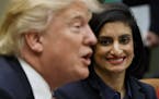 FILE - In this March 22, 2017 file photo, Administrator of the Centers for Medicare and Medicaid Services Seema Verma listen at right as President Don