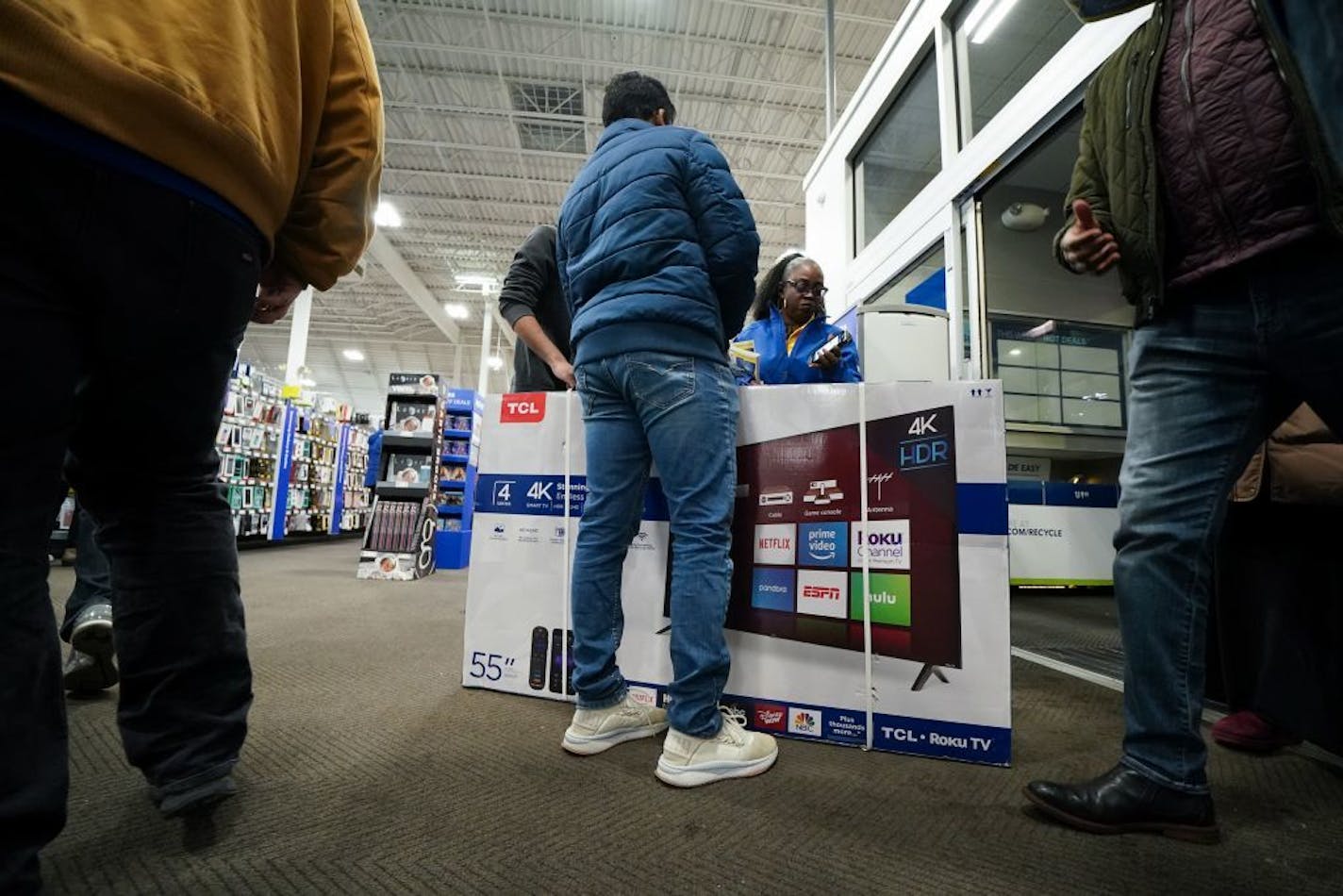 Customers were still pouring still pouring into the store at 5:15 p.m. as the first flat screen televisions were being carried out the door 15 minutes after it opened, at the Best Buy Richfield store Thursday night.