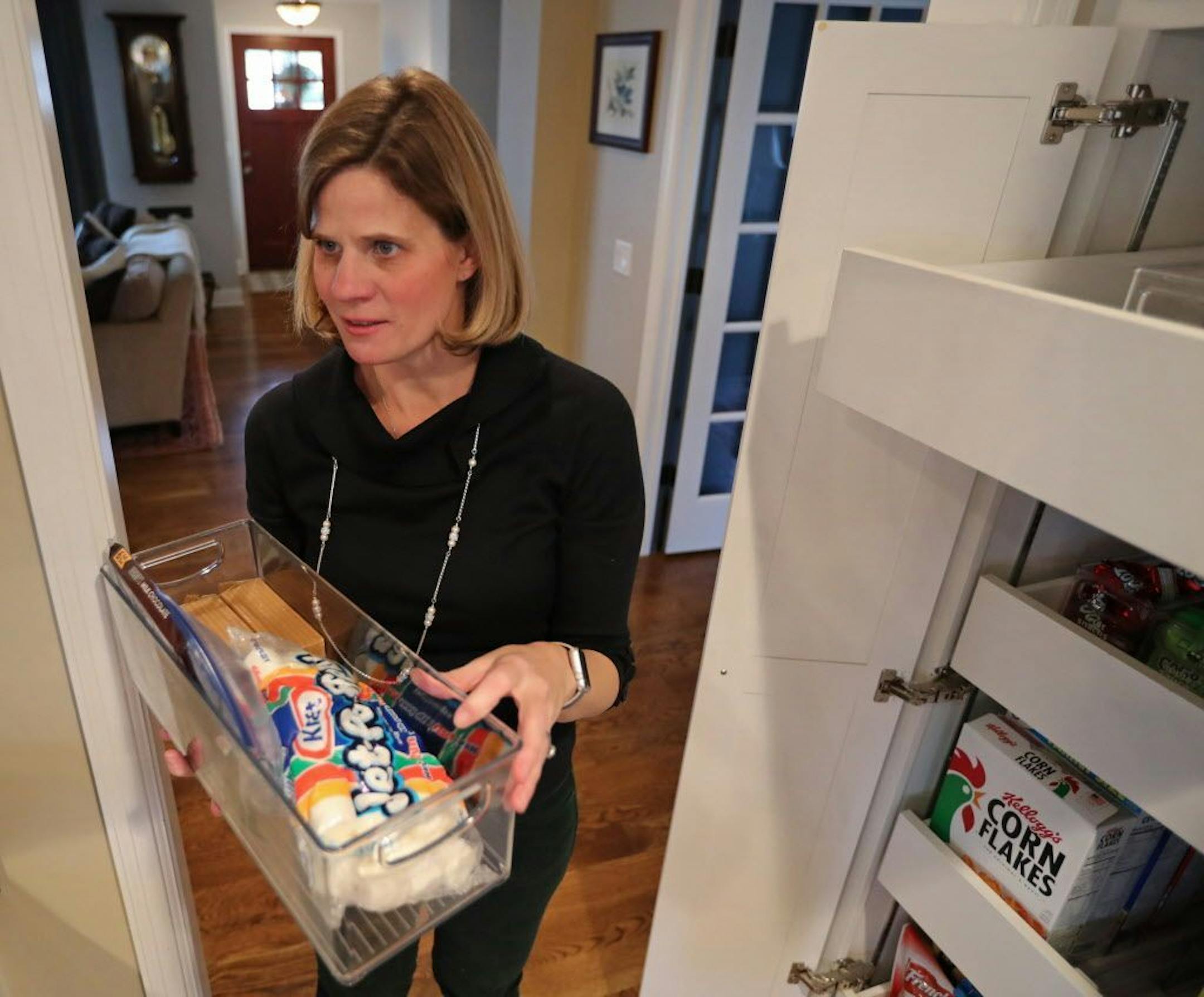 Kershner carries a container that holds s'more ingredients.