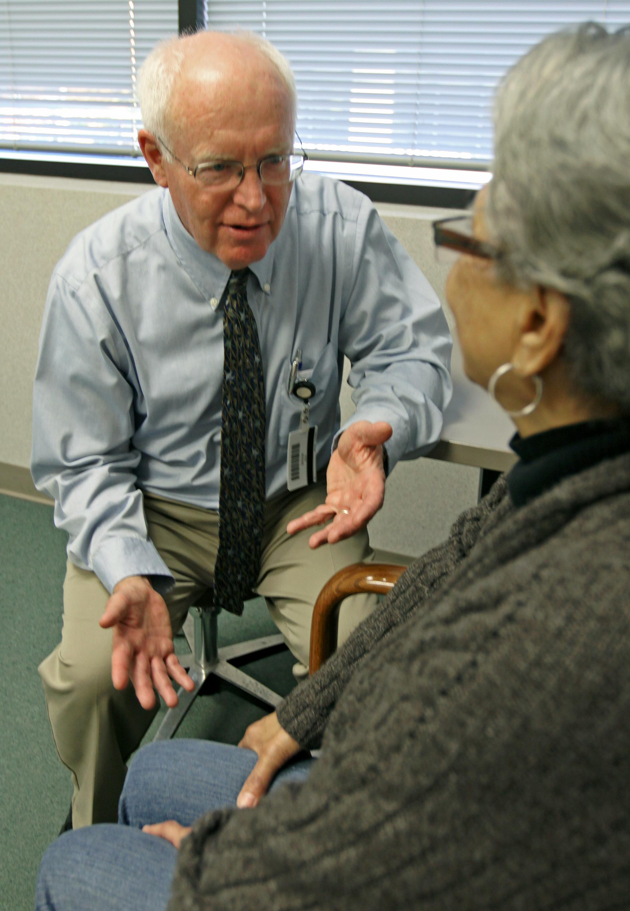 (left to right) Dr. Dick Adair talked with patient Letitia McLaughlin of Minneapolis, during a visit at the ANGMA Medical clinic in Minneapolis.