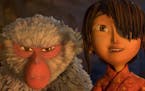 This image released by Focus Features shows characters Kubo, voiced by Art Parkinson, right, and Monkey, voiced by Charlize Theron in a scene from the
