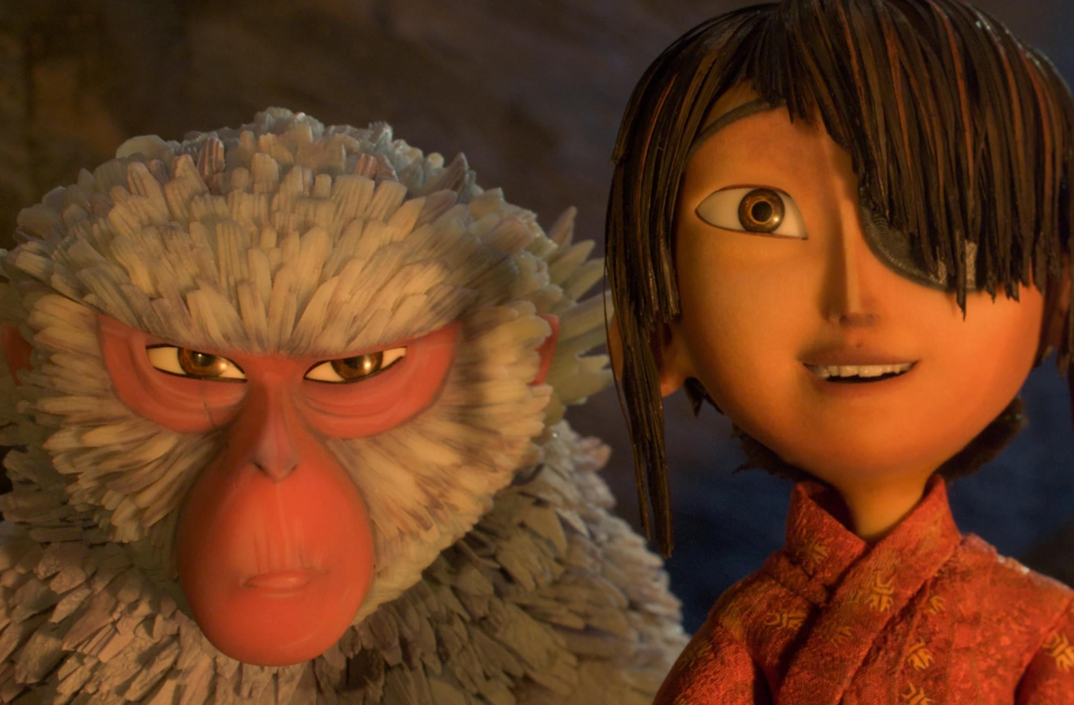 This image released by Focus Features shows characters Kubo, voiced by Art Parkinson, right, and Monkey, voiced by Charlize Theron in a scene from the animated film, "Kubo and the Two Strings." (Laika Studios/Focus Features via AP)