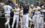 Michigan players celebrated Cody Bruder scored a run in the sixth inning. Michigan played Illinois on day four of the Big Ten baseball tournament at T